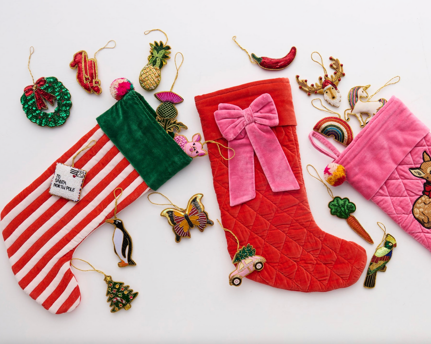 Collection of Christmas stockings and ornaments on a white background