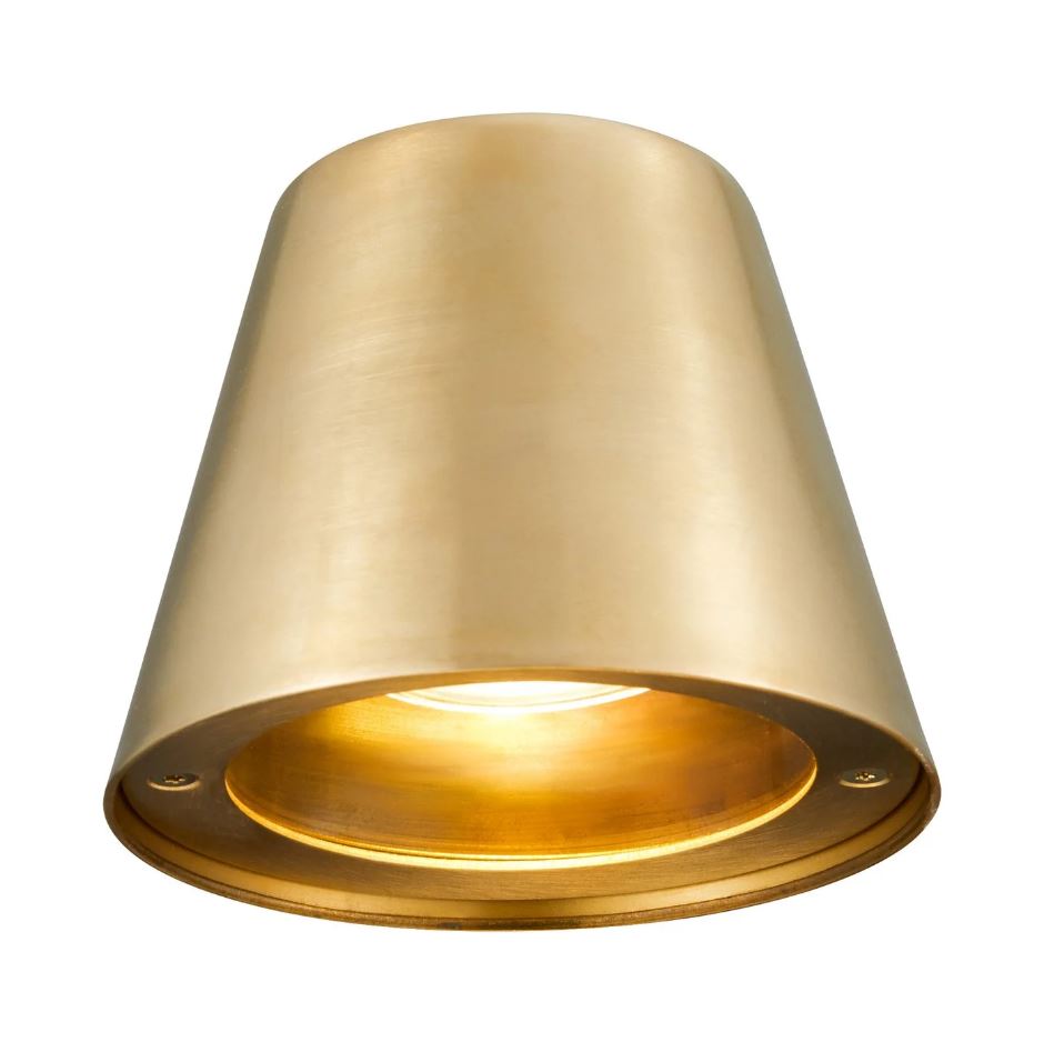 A gold outdoor wall-mounted light with a directional beam, installed on a grey textured wall.