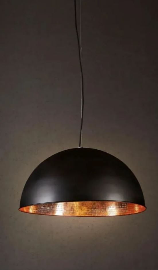 Black pendant light with copper interior on a dark background