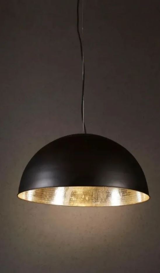 Black pendant light with gold interior on a dark background