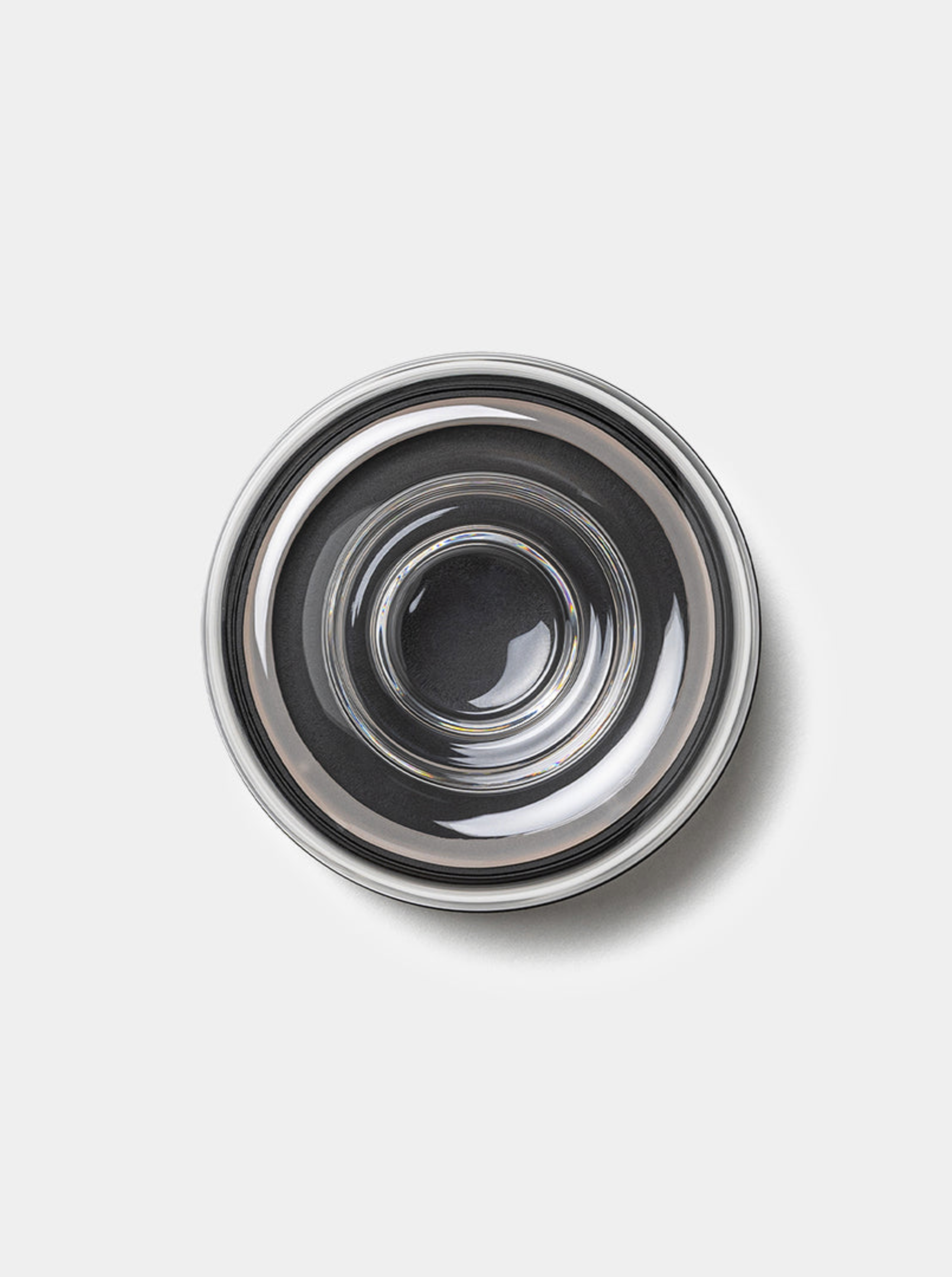 Metallic glass wall light on a white background