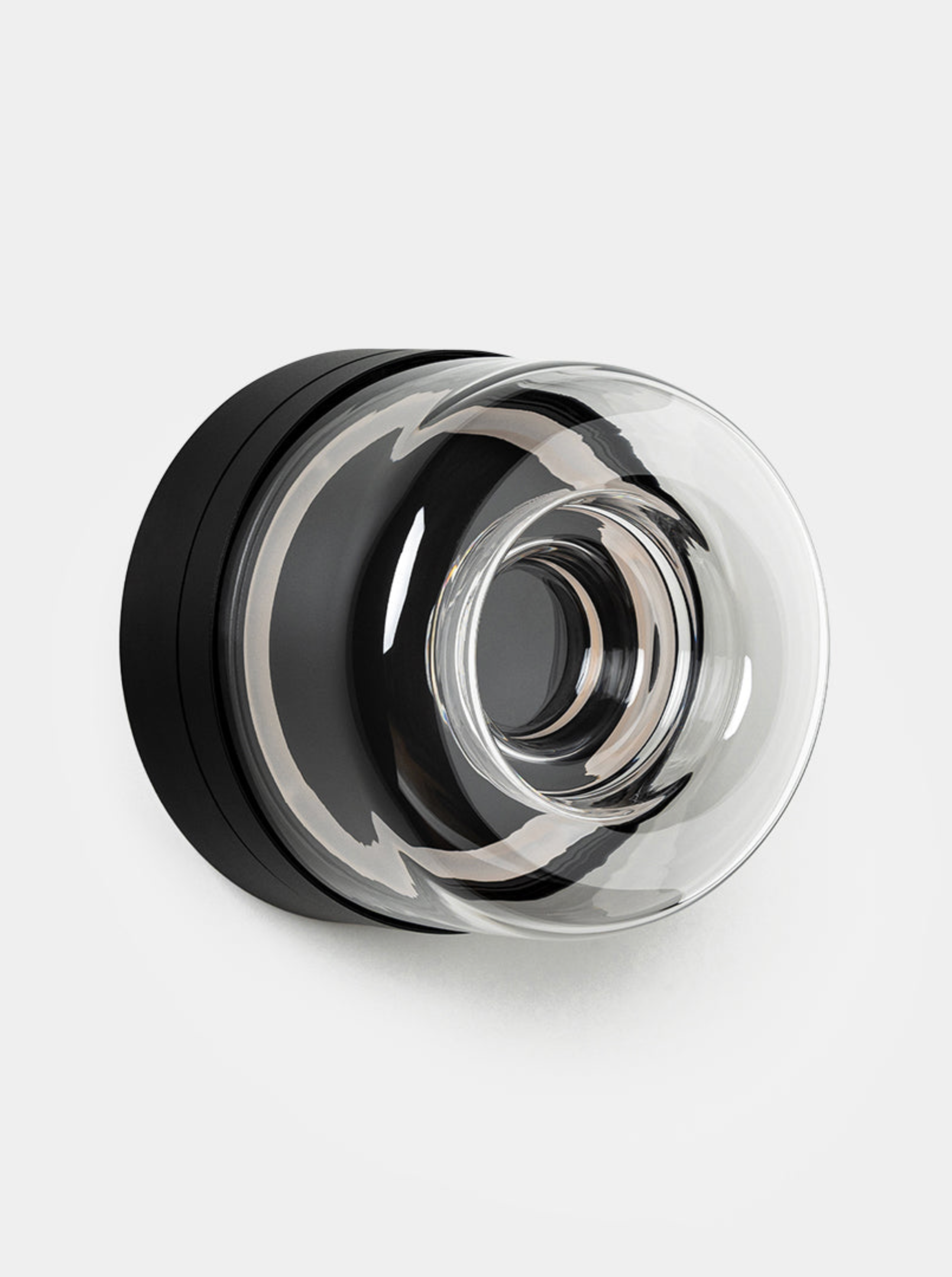 Wall light with reflective surface on a light background