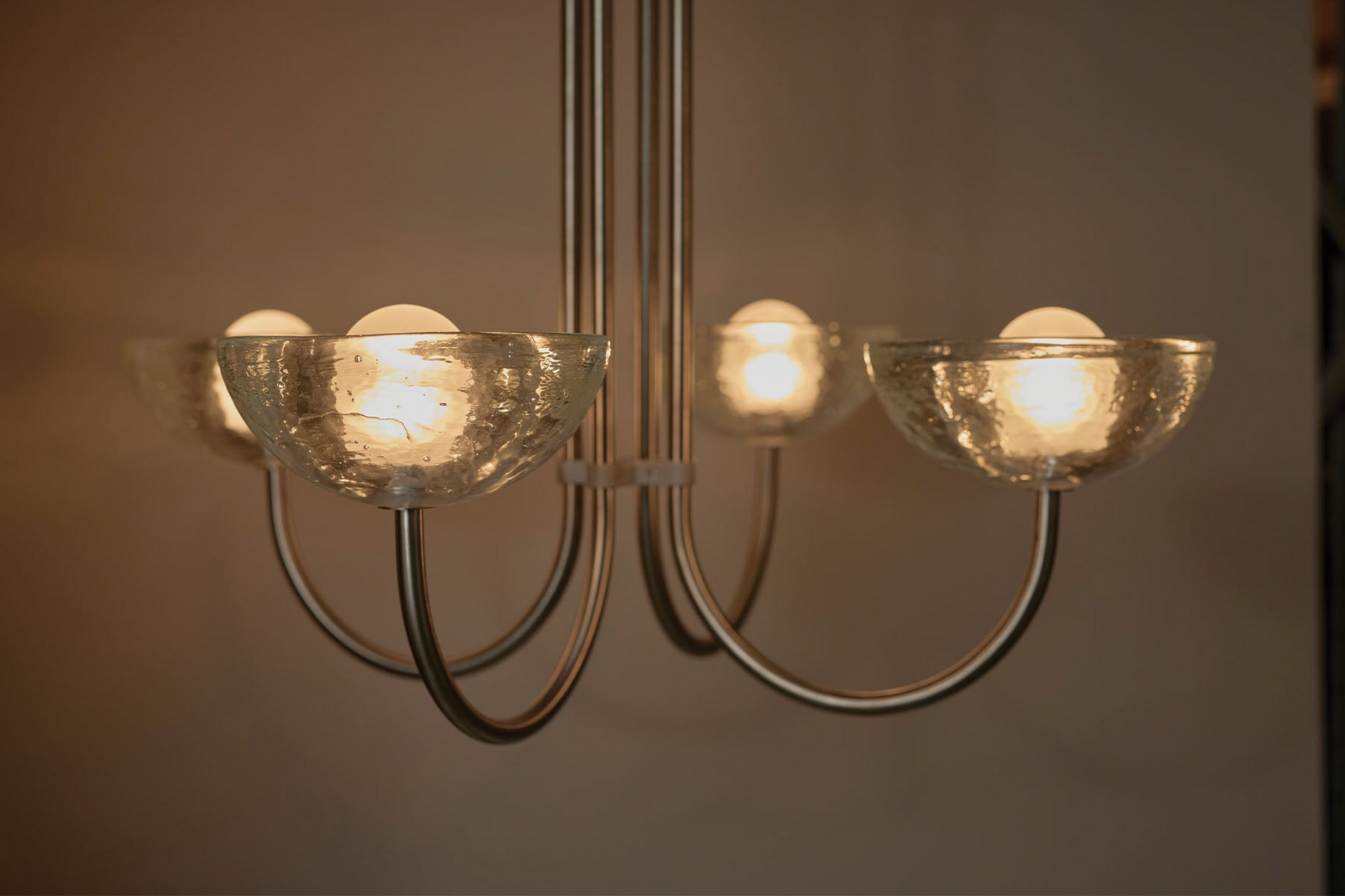 Chandelier with glass shades on a neutral background