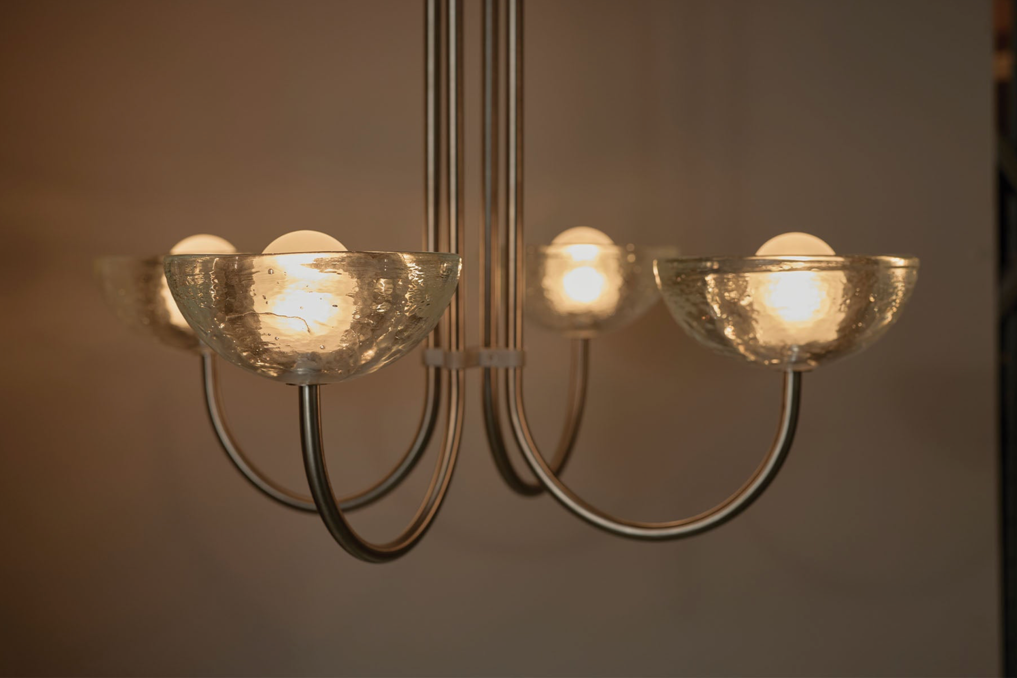 Chandelier with glass shades on a neutral background