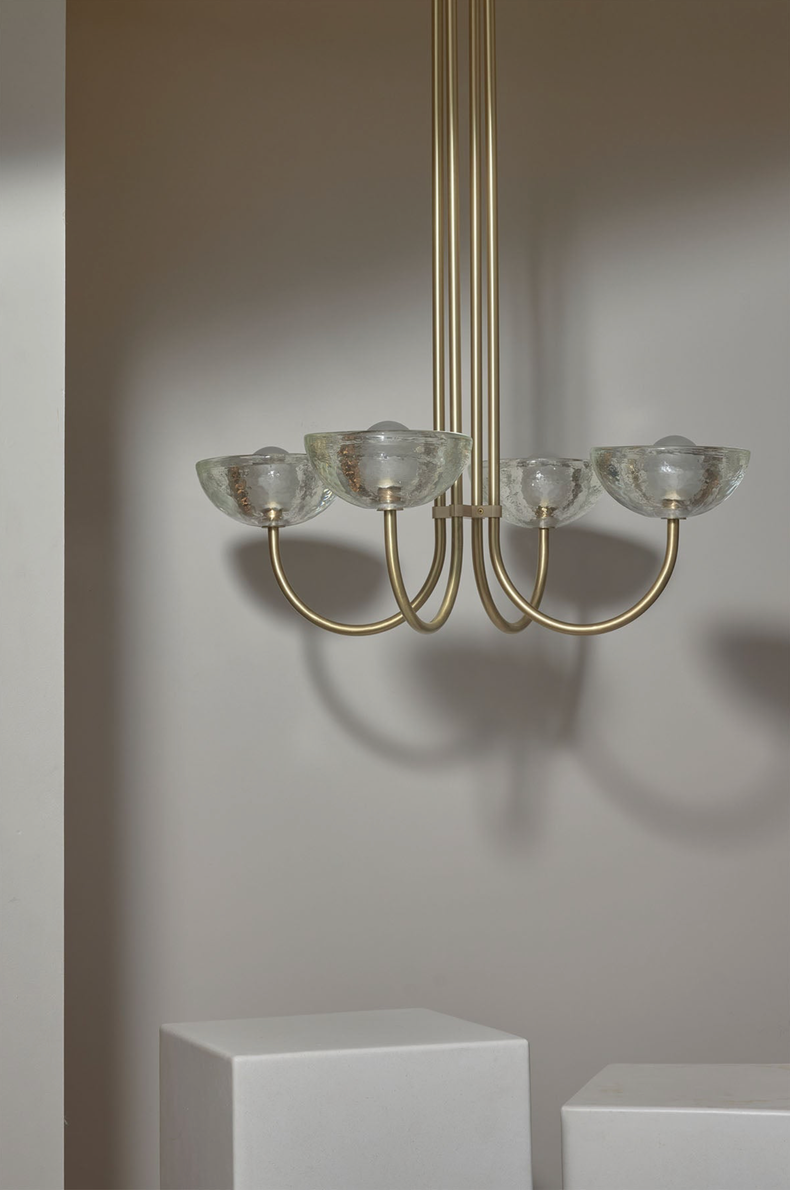 Chandelier with glass shades on a neutral background