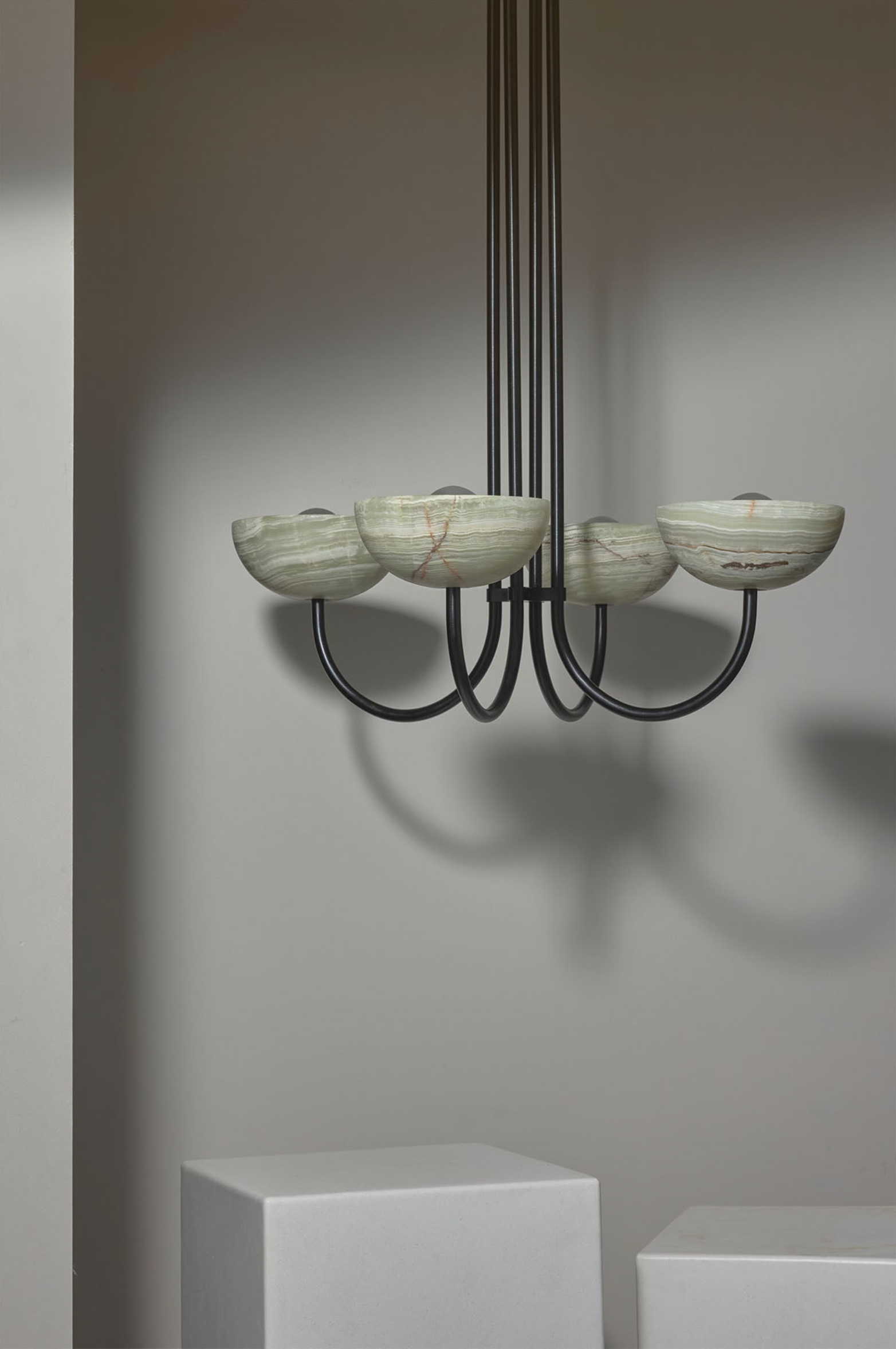 Modern chandelier with marble-like finish on a neutral background