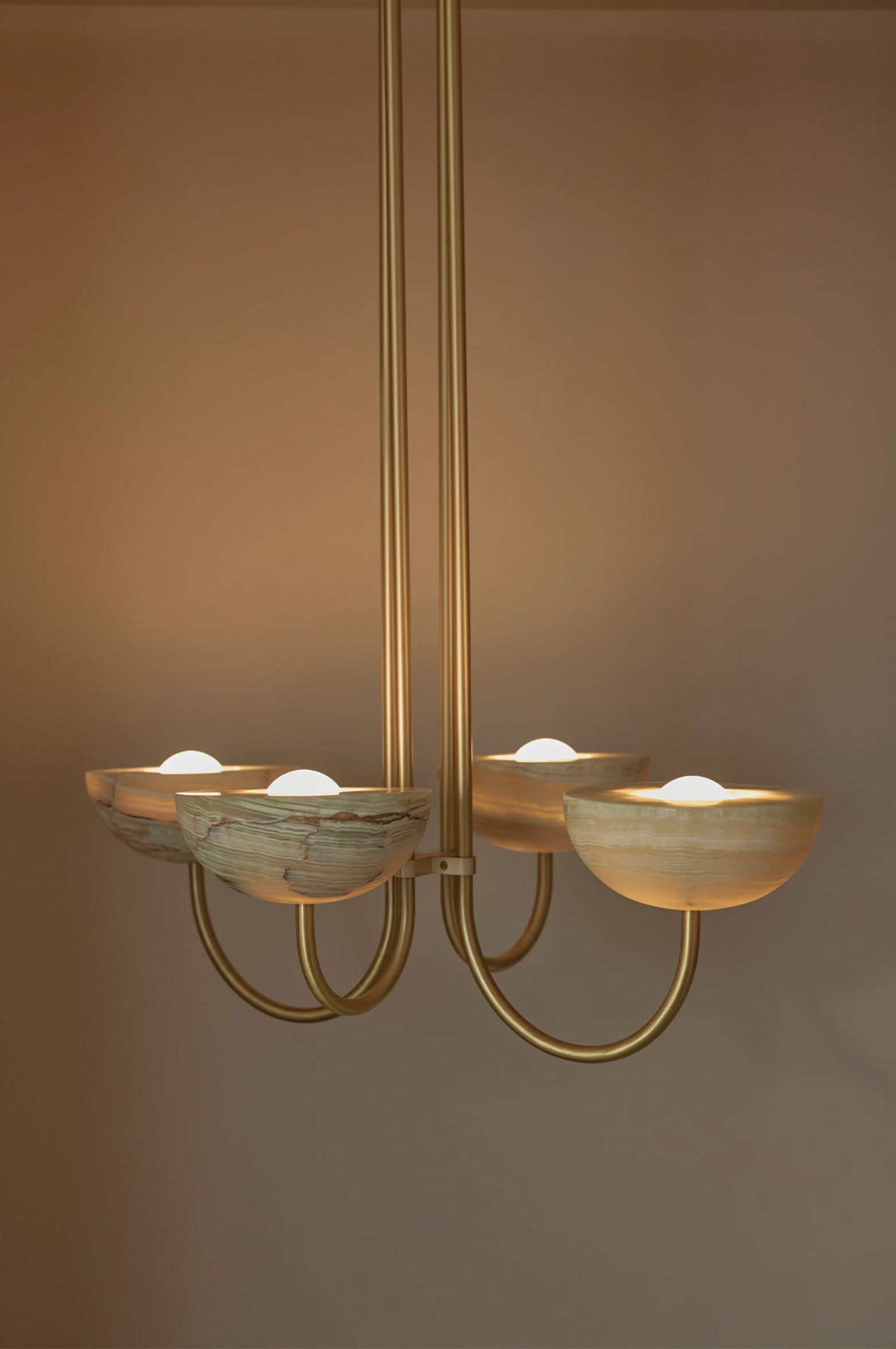 Chandelier with glass shades on a plain background