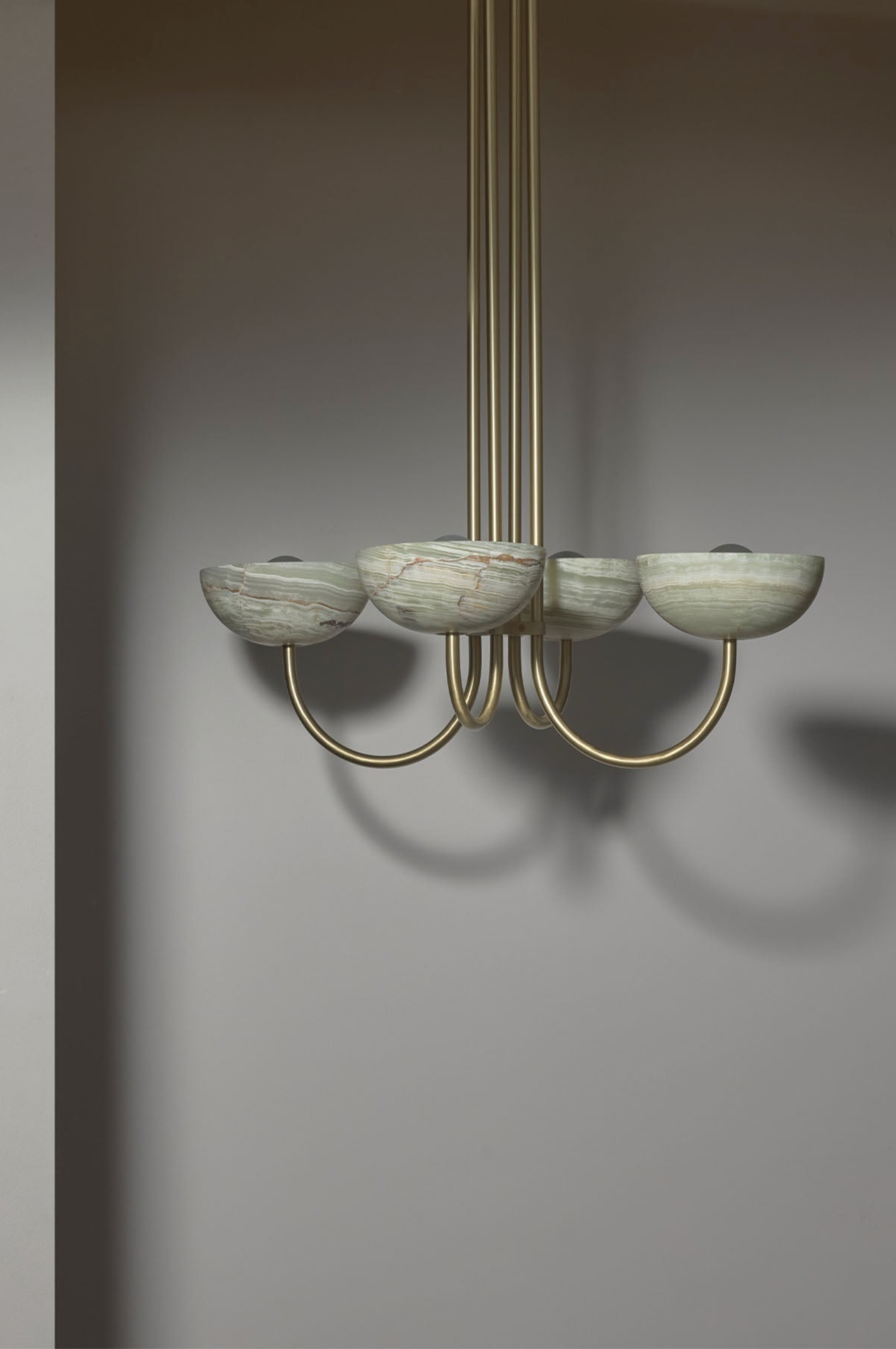 Chandelier with marble-like shades on a grey background