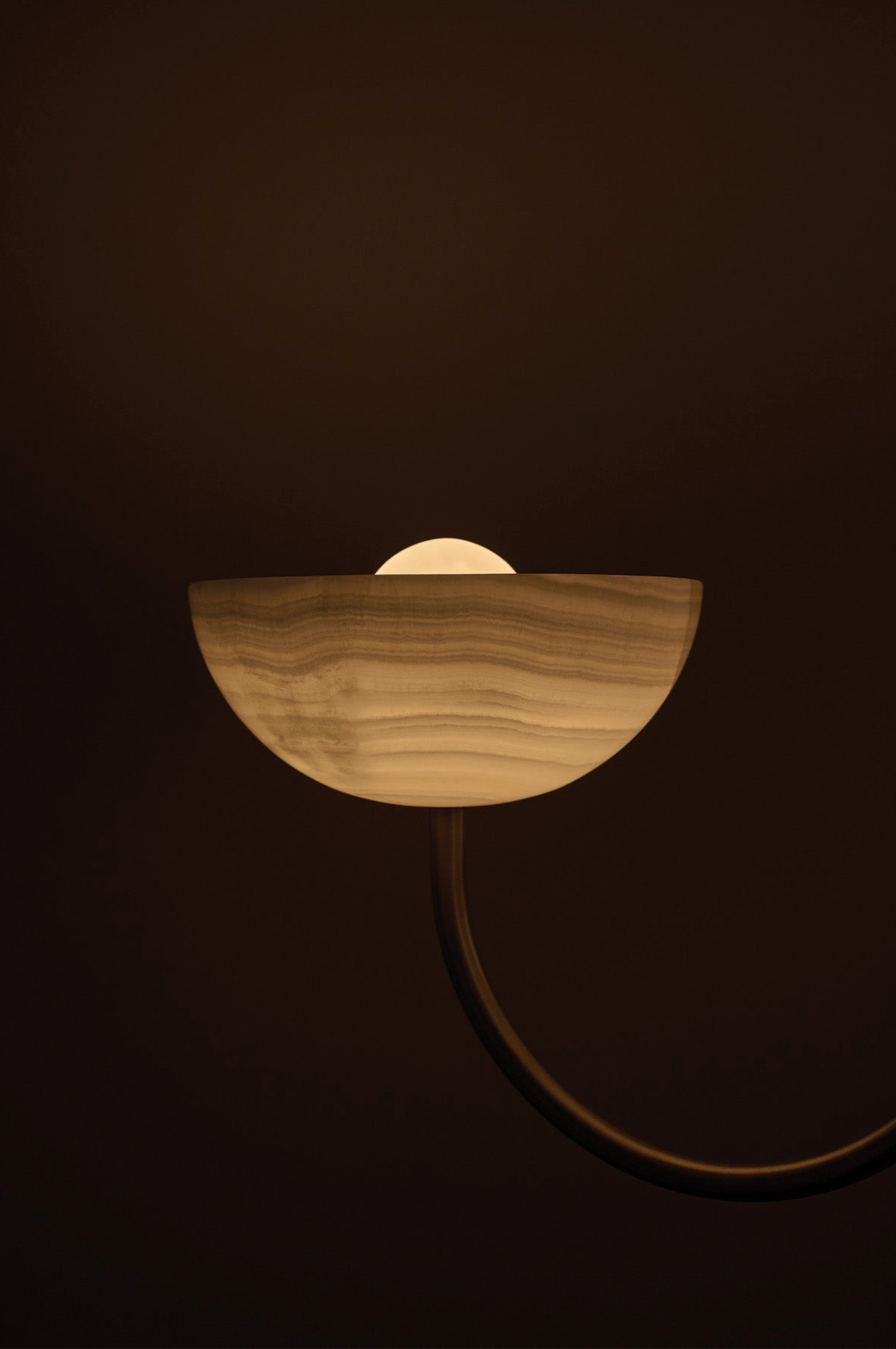 close up of chandelier light fixture on a dark background