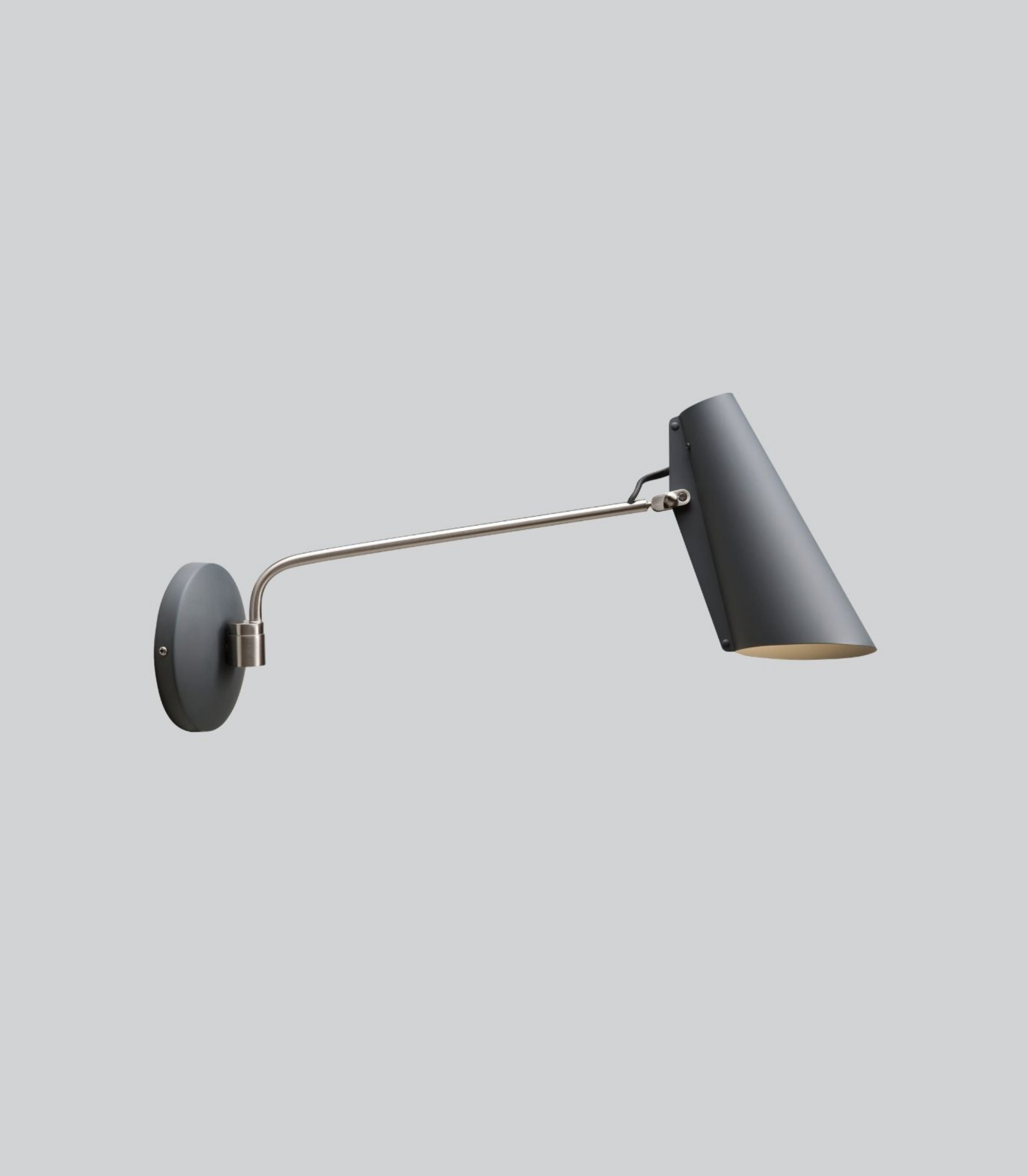 Wall-mounted lamp with a long arm on a light gray background
