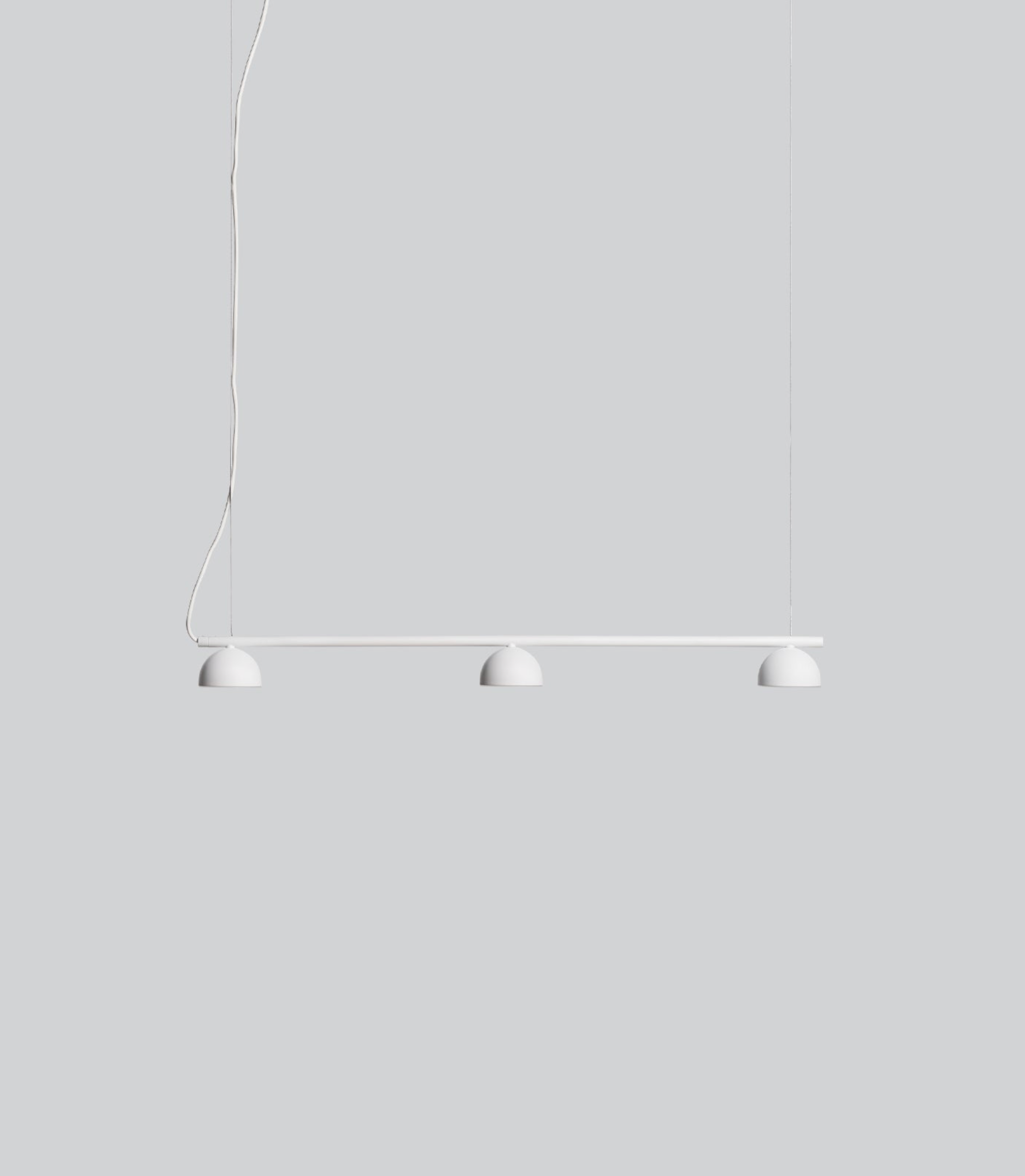 Modern white pendant light with three white lampshades on a grey background