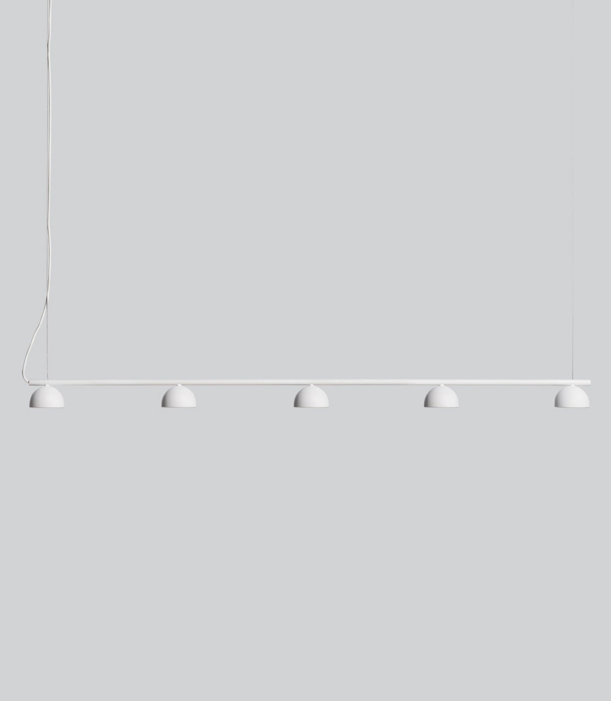 Modern pendant light with five round lampshades on a plain white background