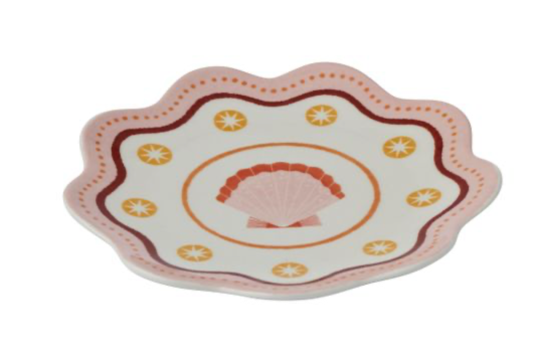 Decorative plate with shell design on a white background