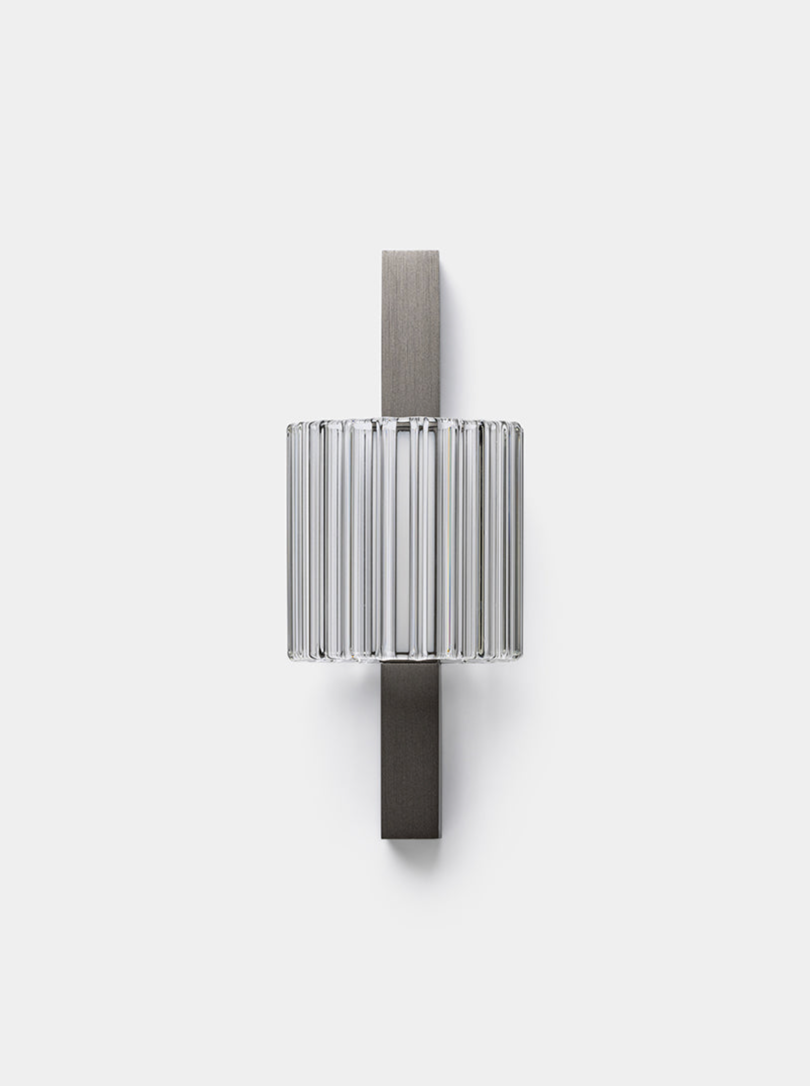 Modern wall sconce with metallic finish on a white background