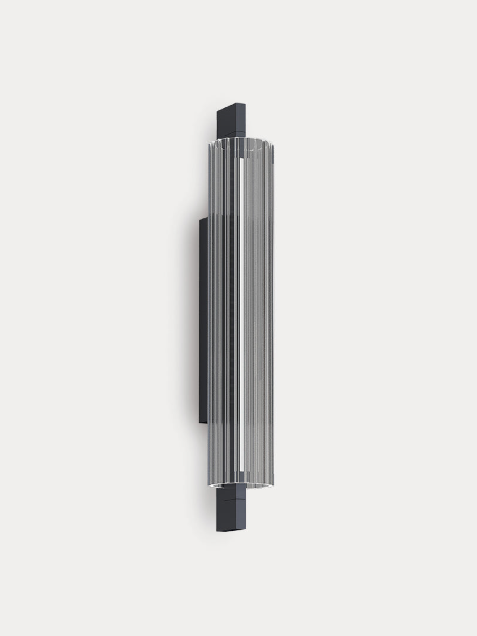 Metallic cylindrical wall light on a white background
