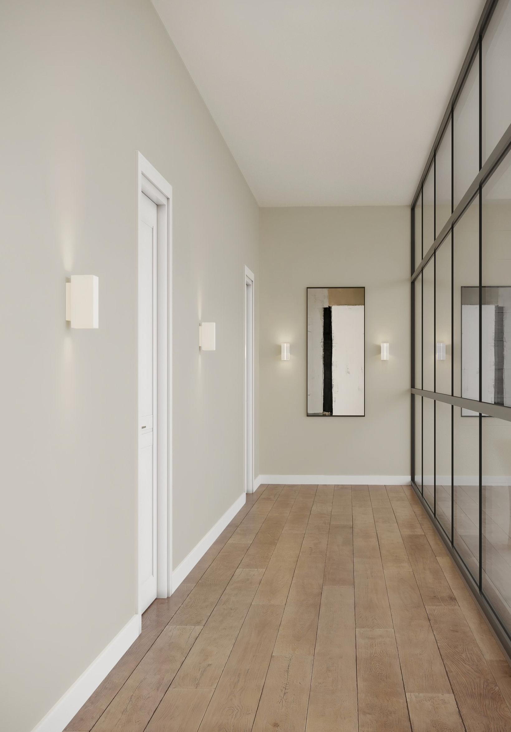 Modern hallway with light wood flooring, neutral walls, and a vertical mirror.