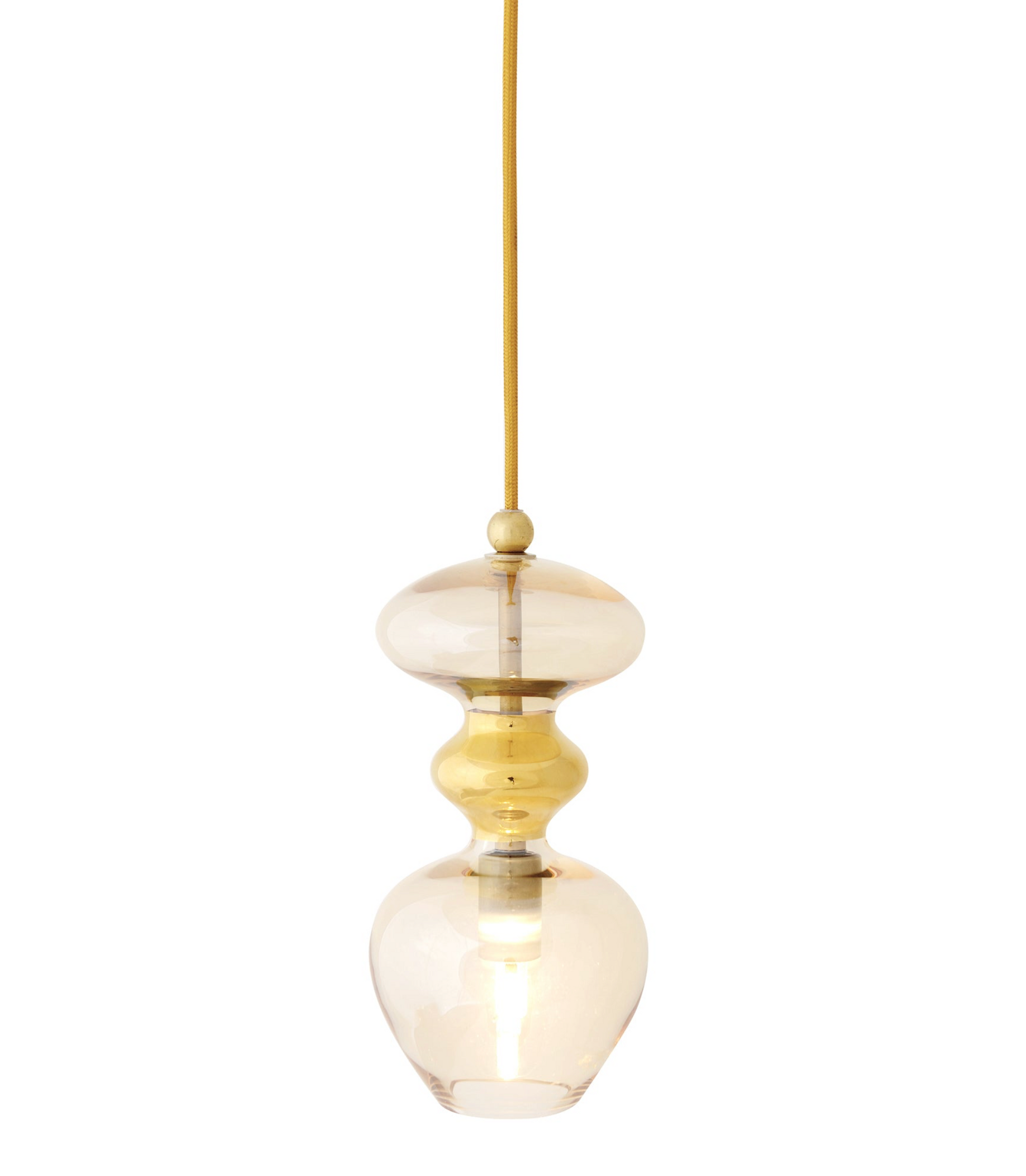 Gold and glass pendant light on a white background