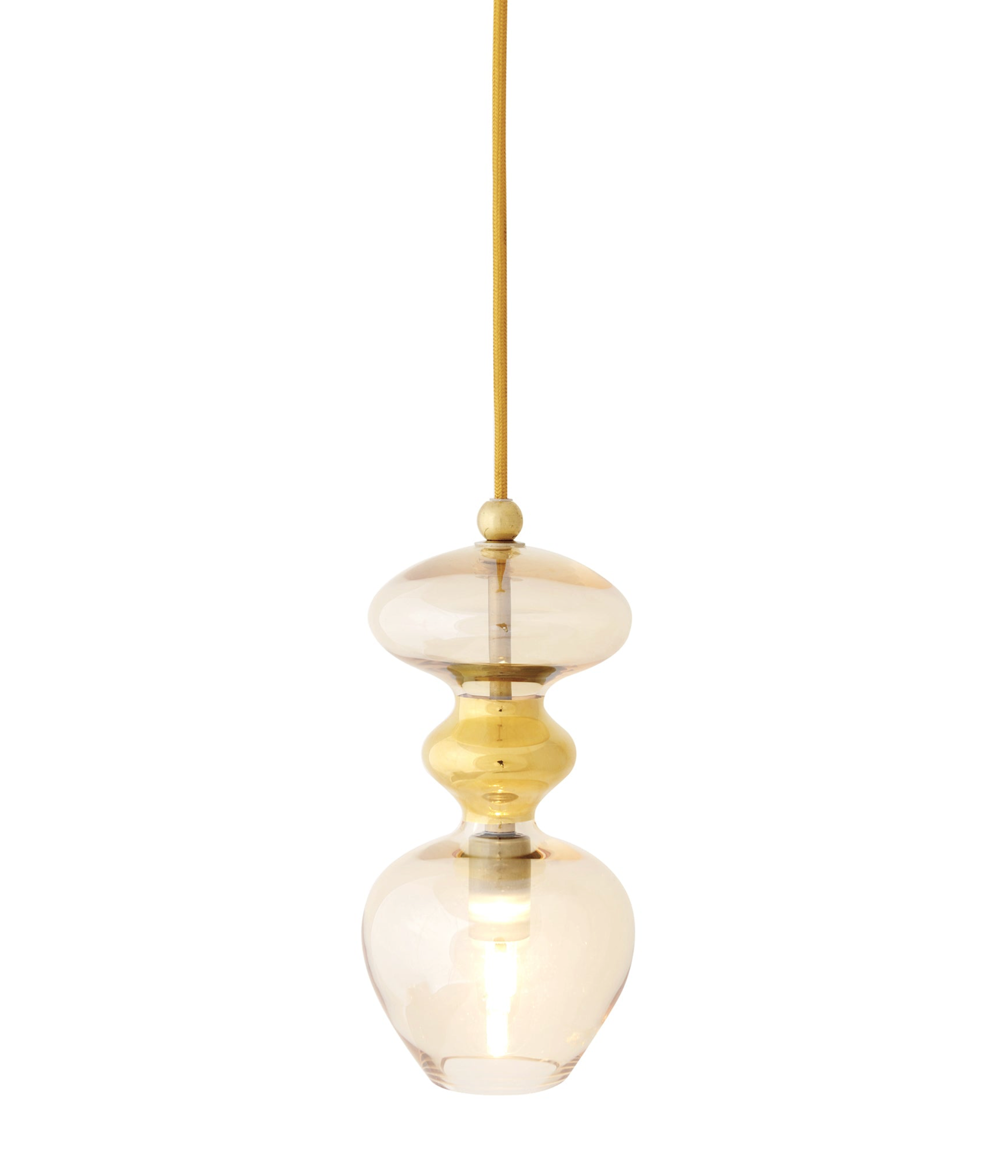 Gold and glass pendant light on a white background