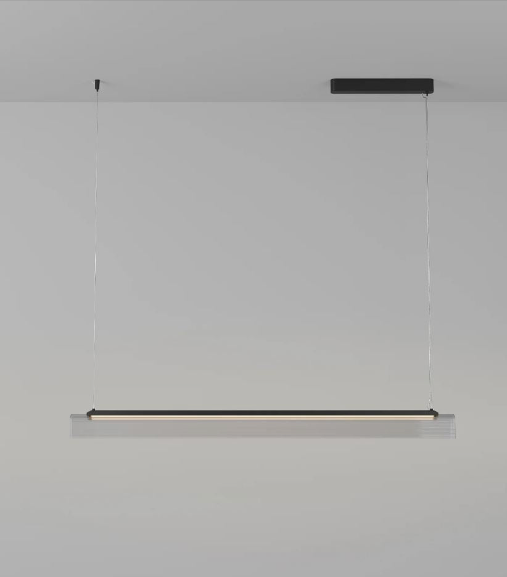 Modern black linear  pendant light fixture on a grey background