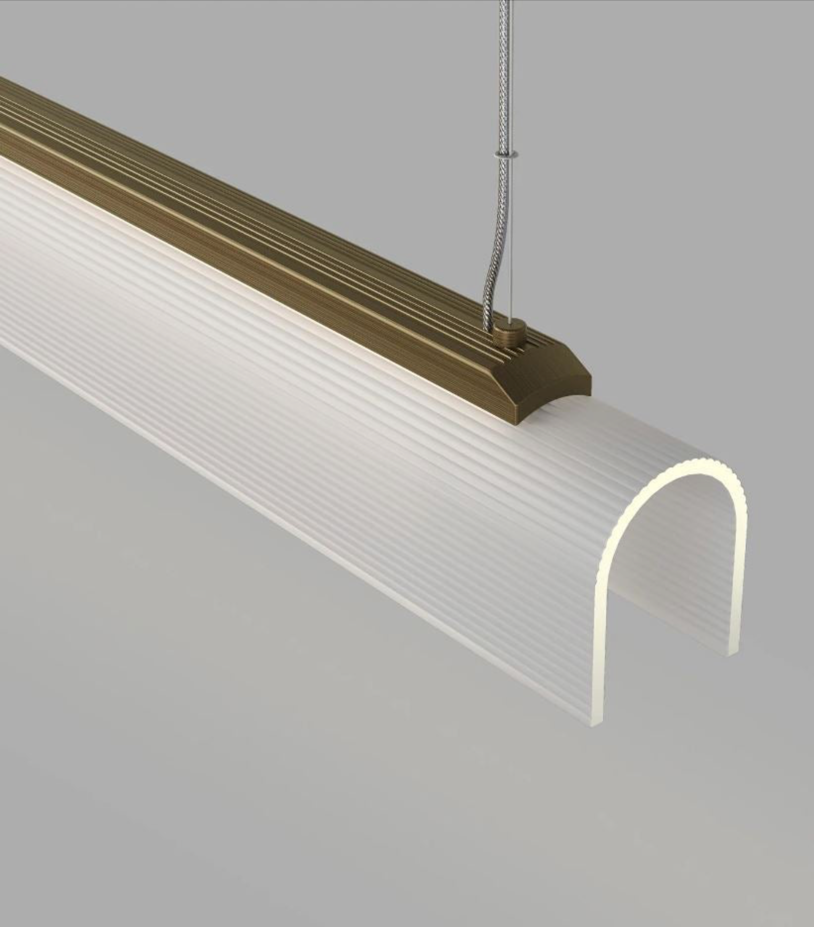 Modern linear pendant light with a curved design on a grey background