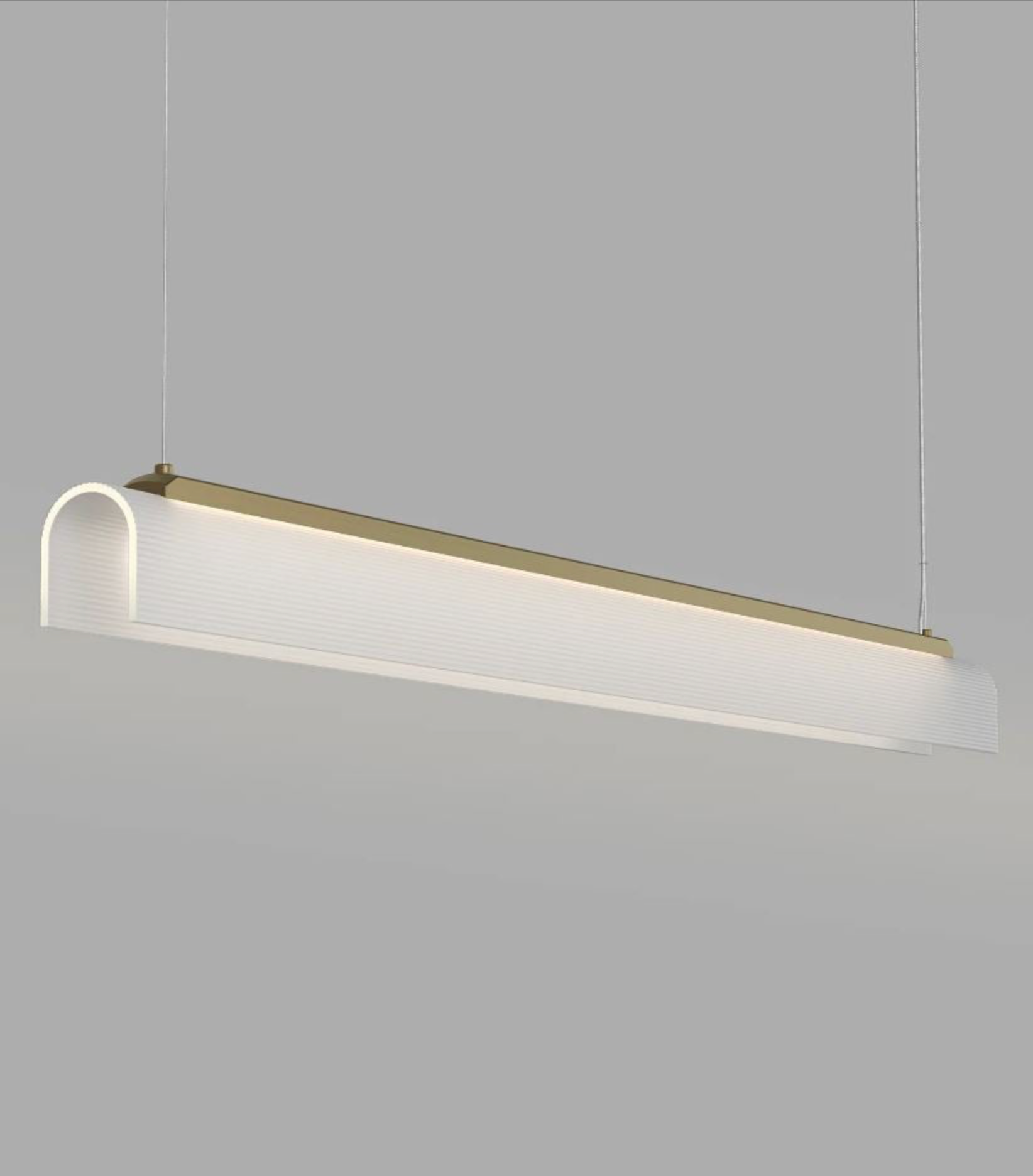 Modern brass and glass linear curved pendant light with a minimalist design on a grey background