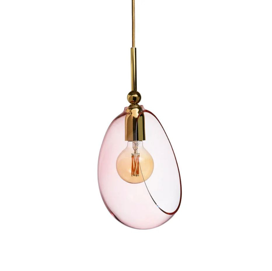 Pink glass pendant light with gold fixture on a white background