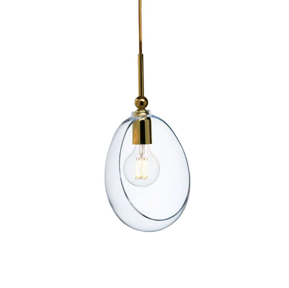 Modern pendant light with clear glass shade and gold fixture on a white background