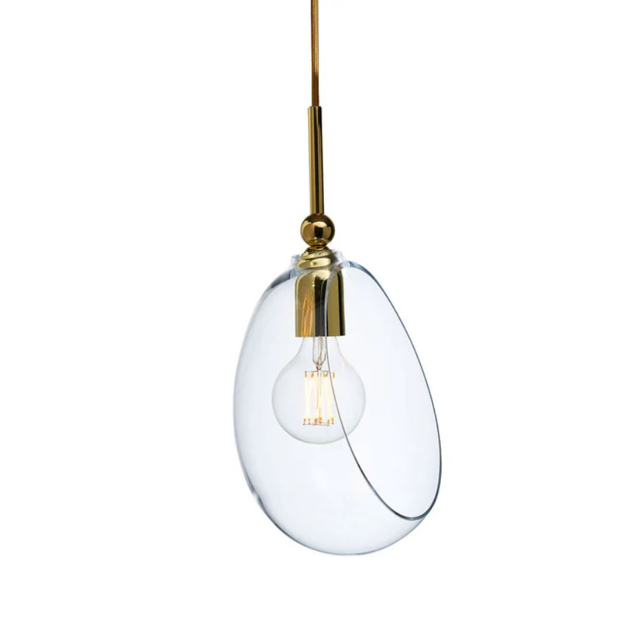 Clear glass pendant light with gold fixture on a white background