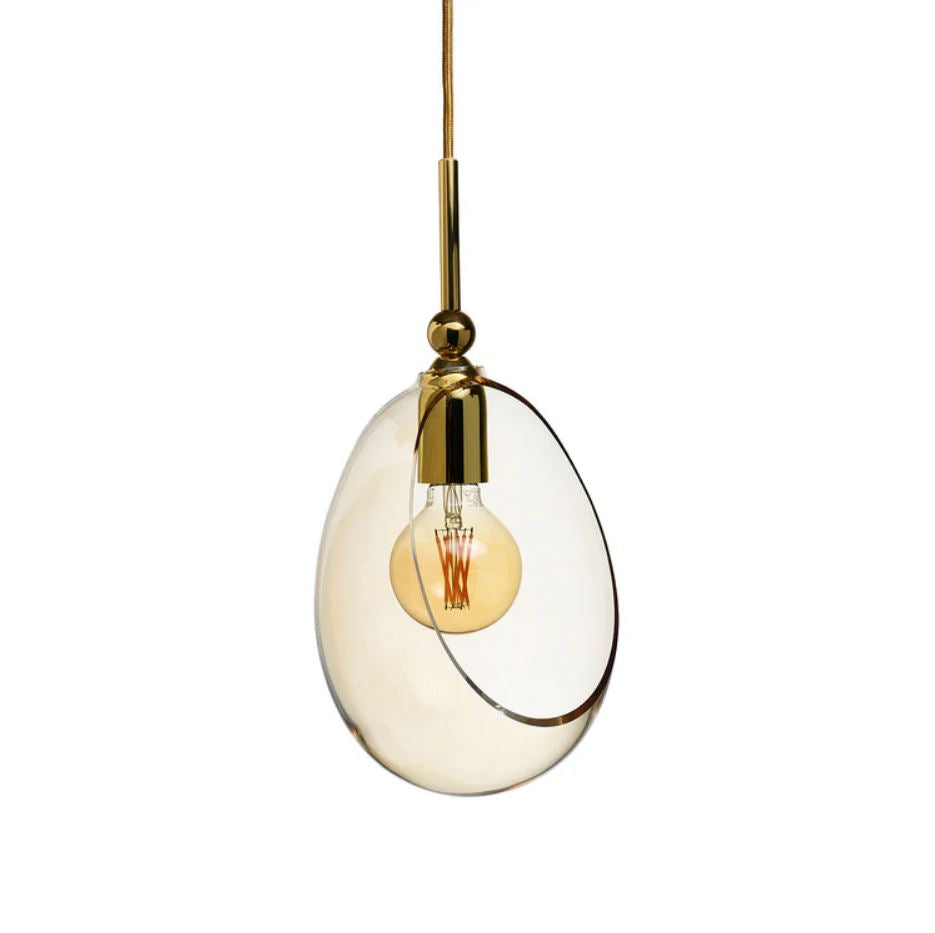 Pendant light with gold fixture and golden glass shade on a white background