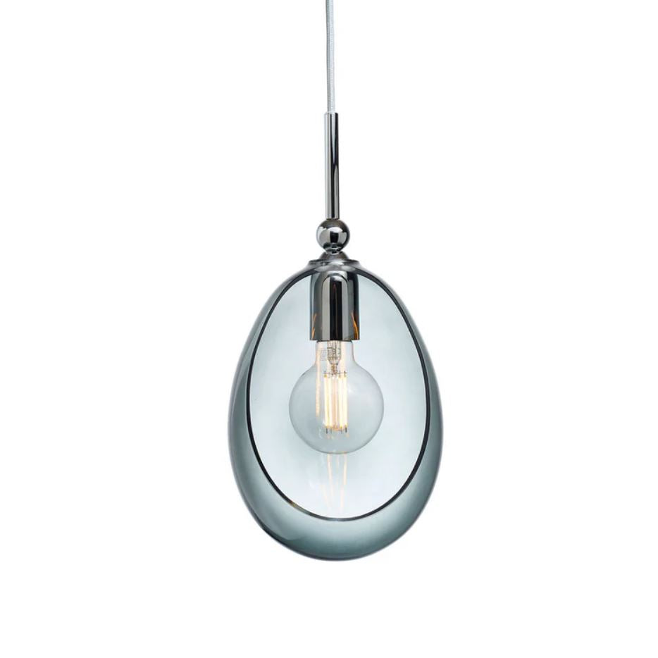Pendant light with coloured glass shade and chrome fixture on a white background