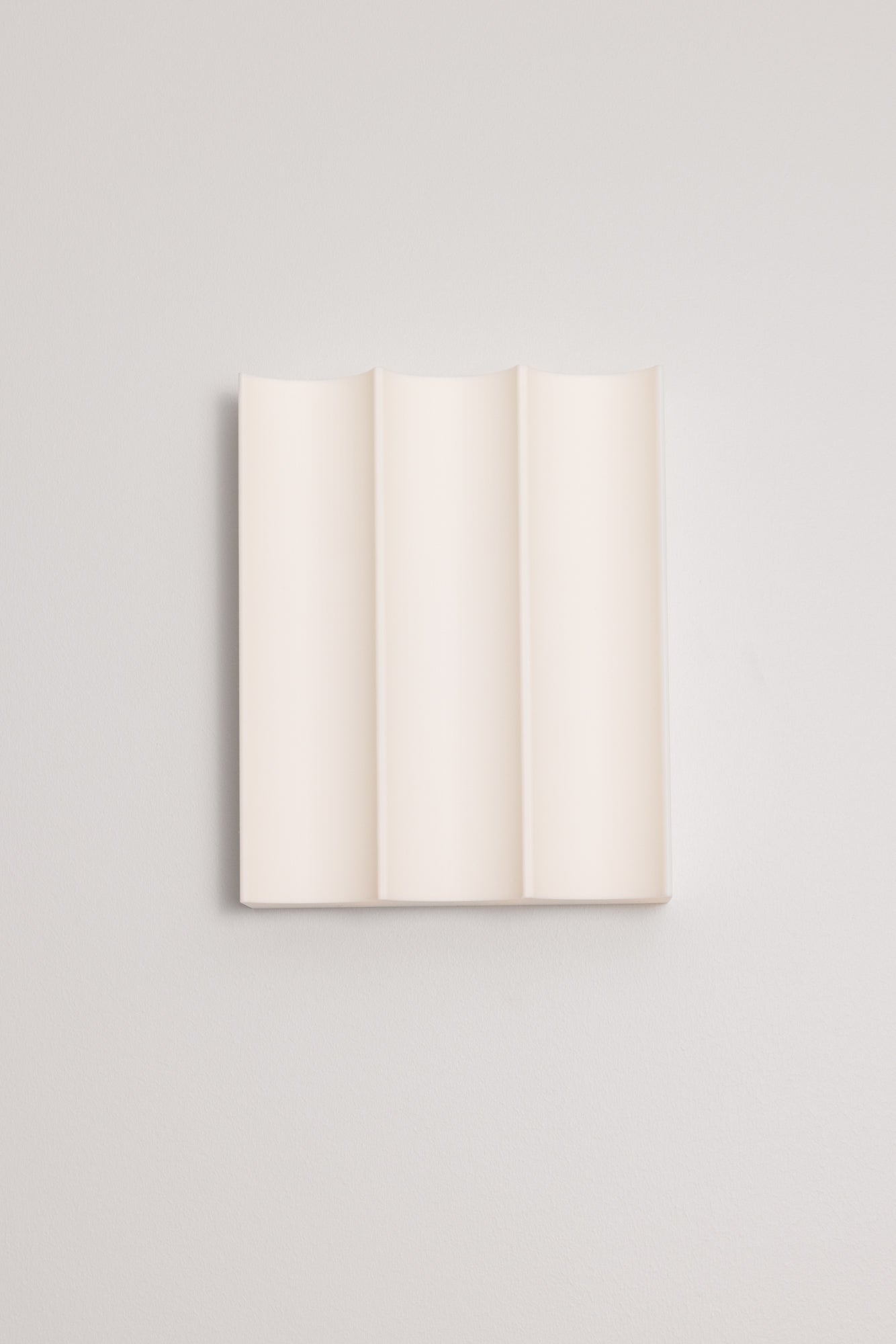 3D printed wall light on a light grey background