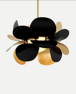 Modern chandelier with black and gold design on a white background