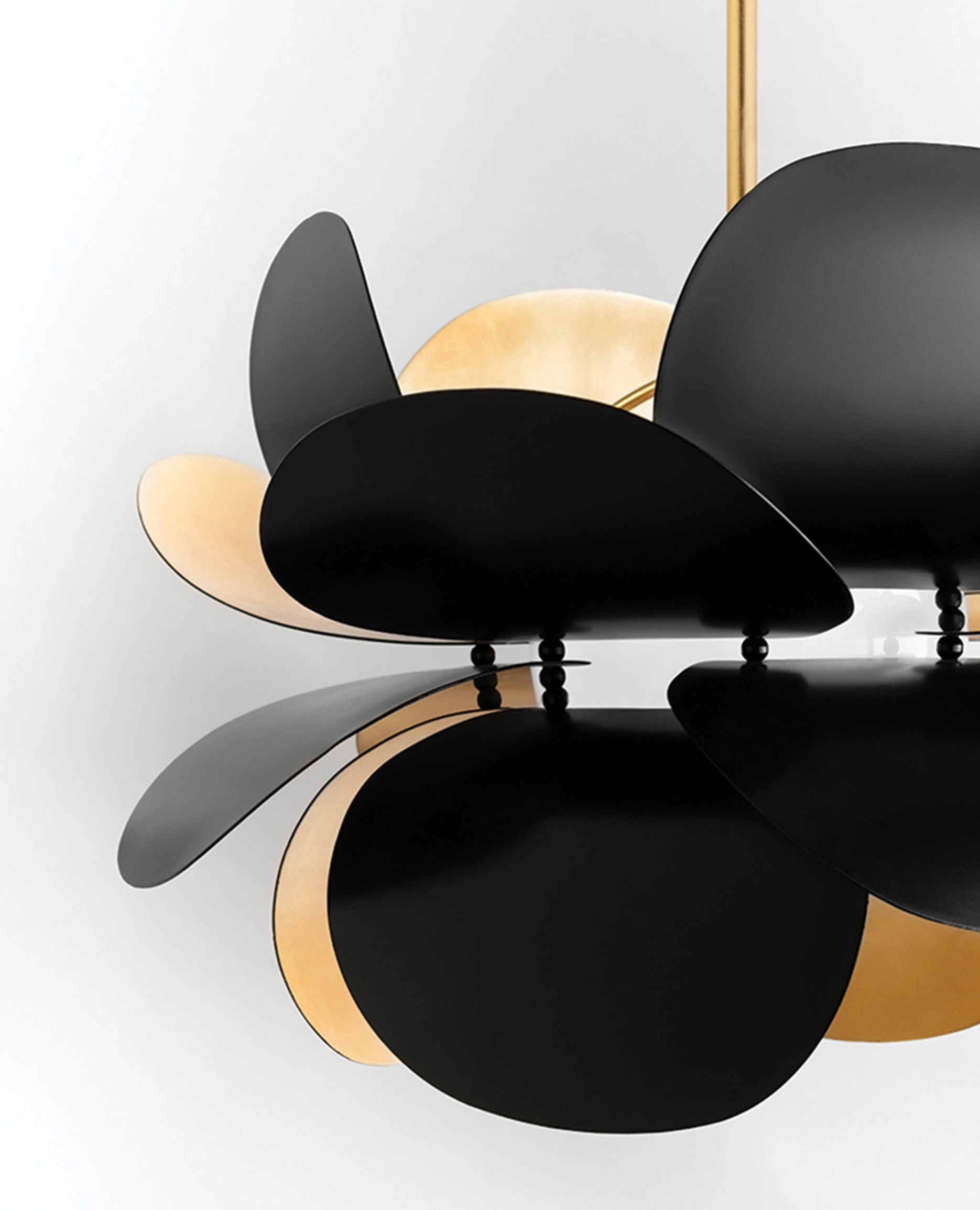 Black and gold ceiling light fixture on a white background