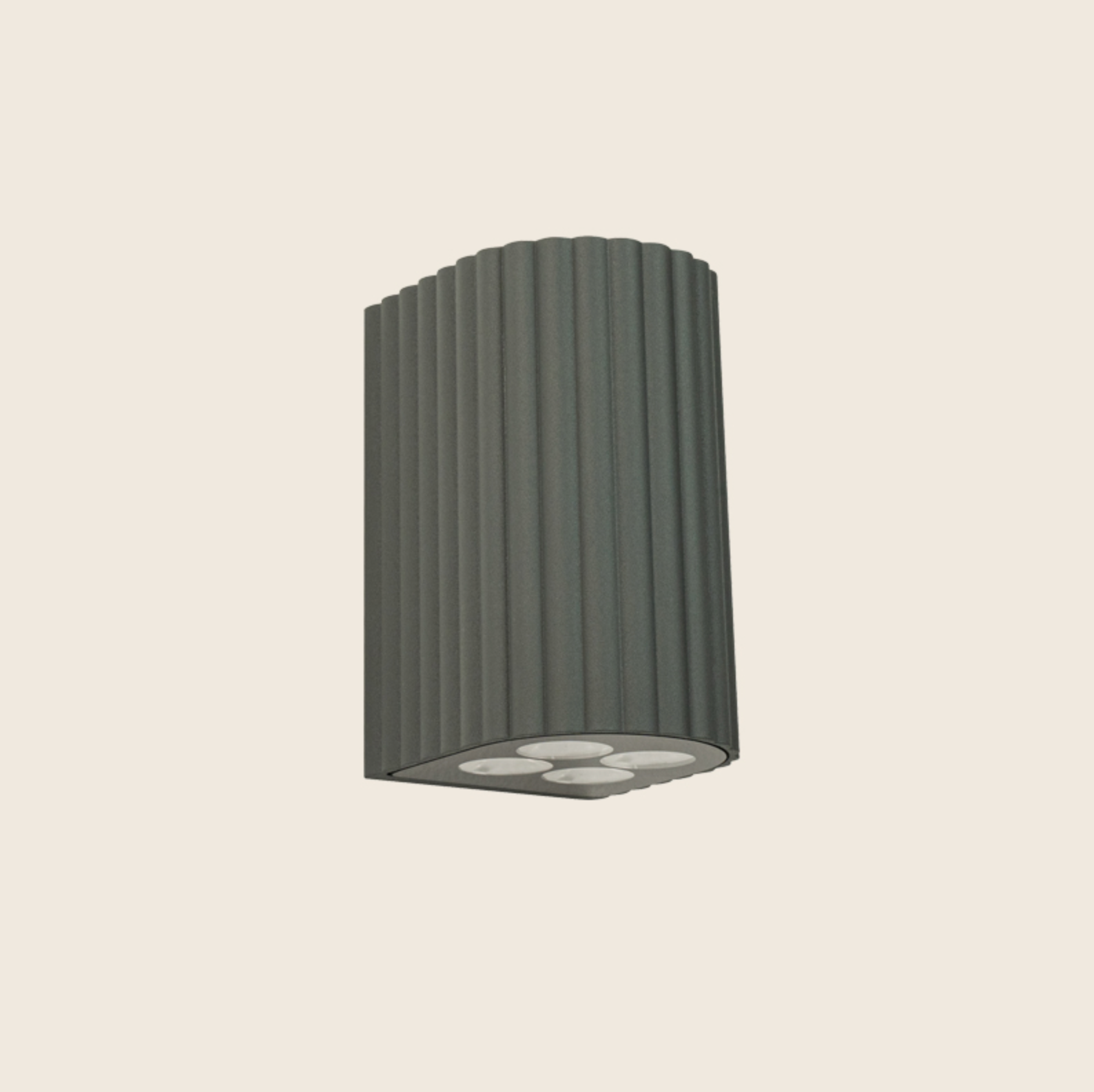 Dark grey cylindrical outdoor light fixture on a beige background