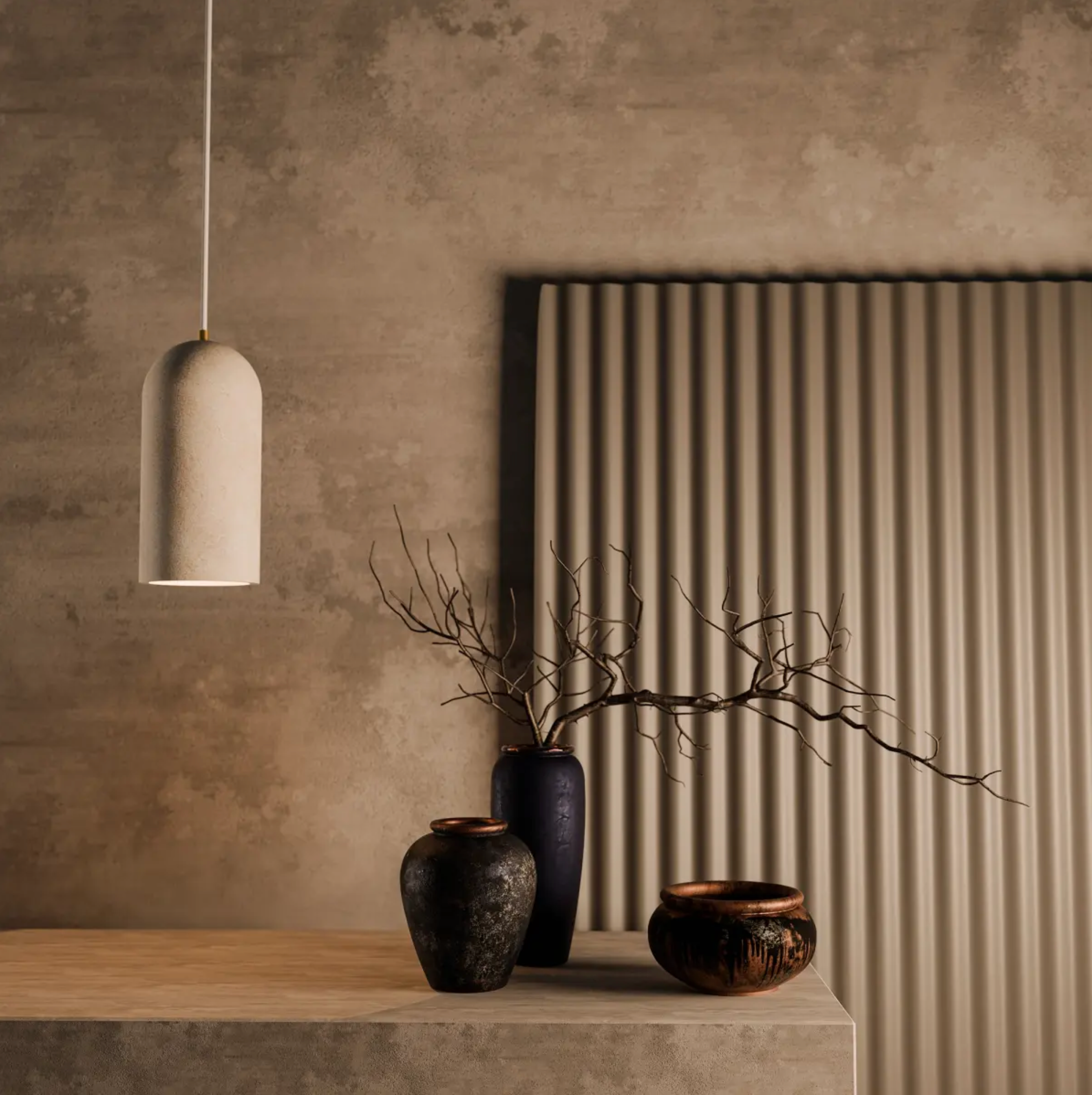Decorative vases and a travertine pendant light on a wooden surface with a textured wall background