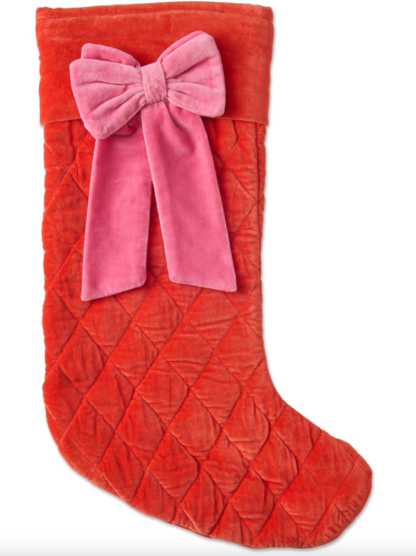 Red quilted Christmas stocking with a pink bow on a white background
