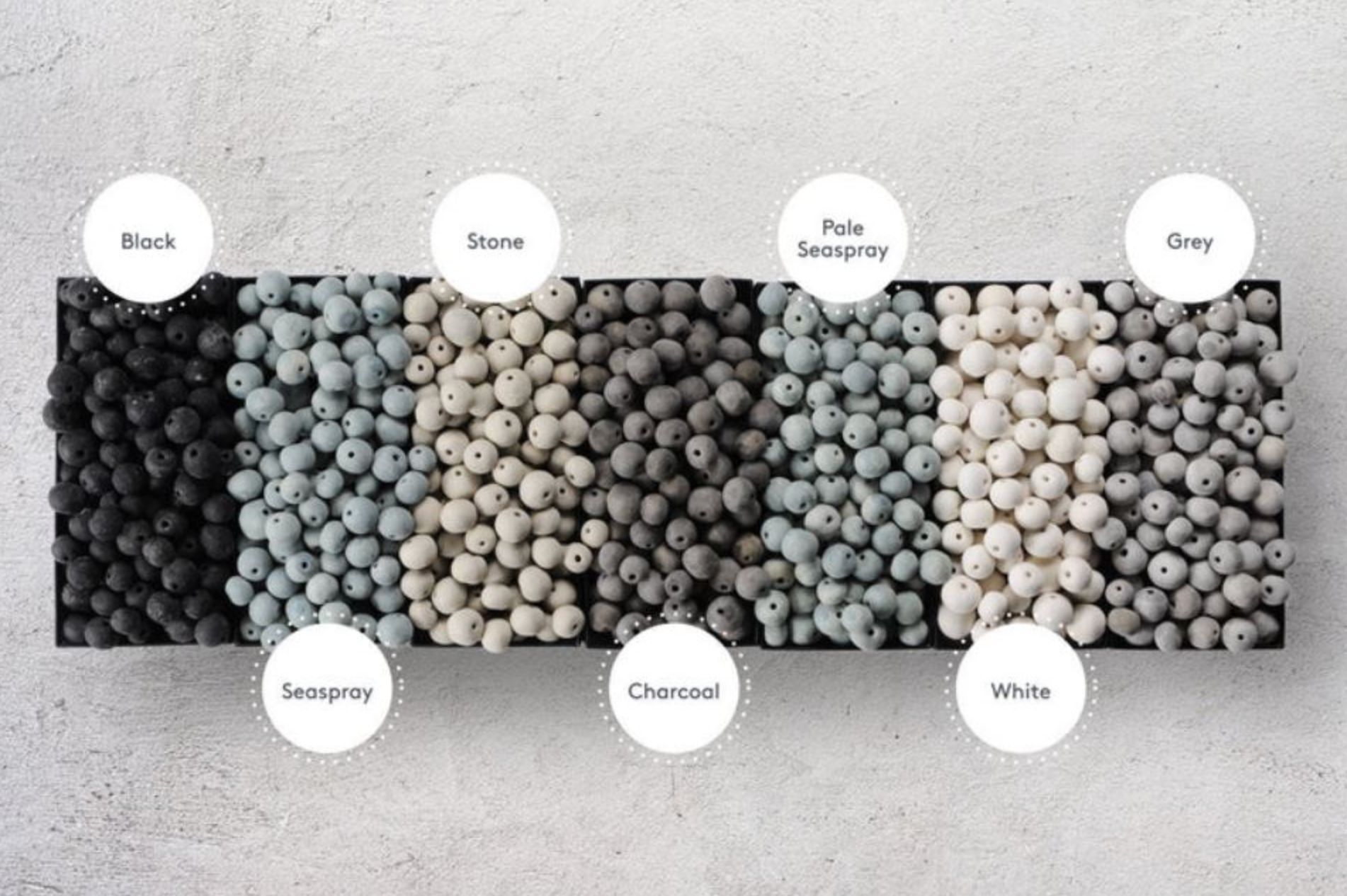 Color swatch of clay beads labeled with colour names on a grey background