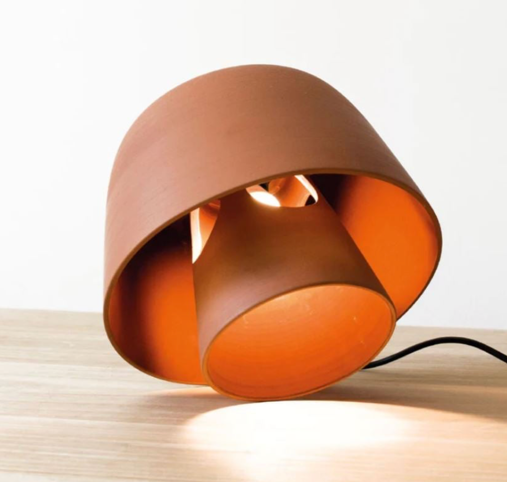 Modern table lamp with a brown and orange design on a light background
