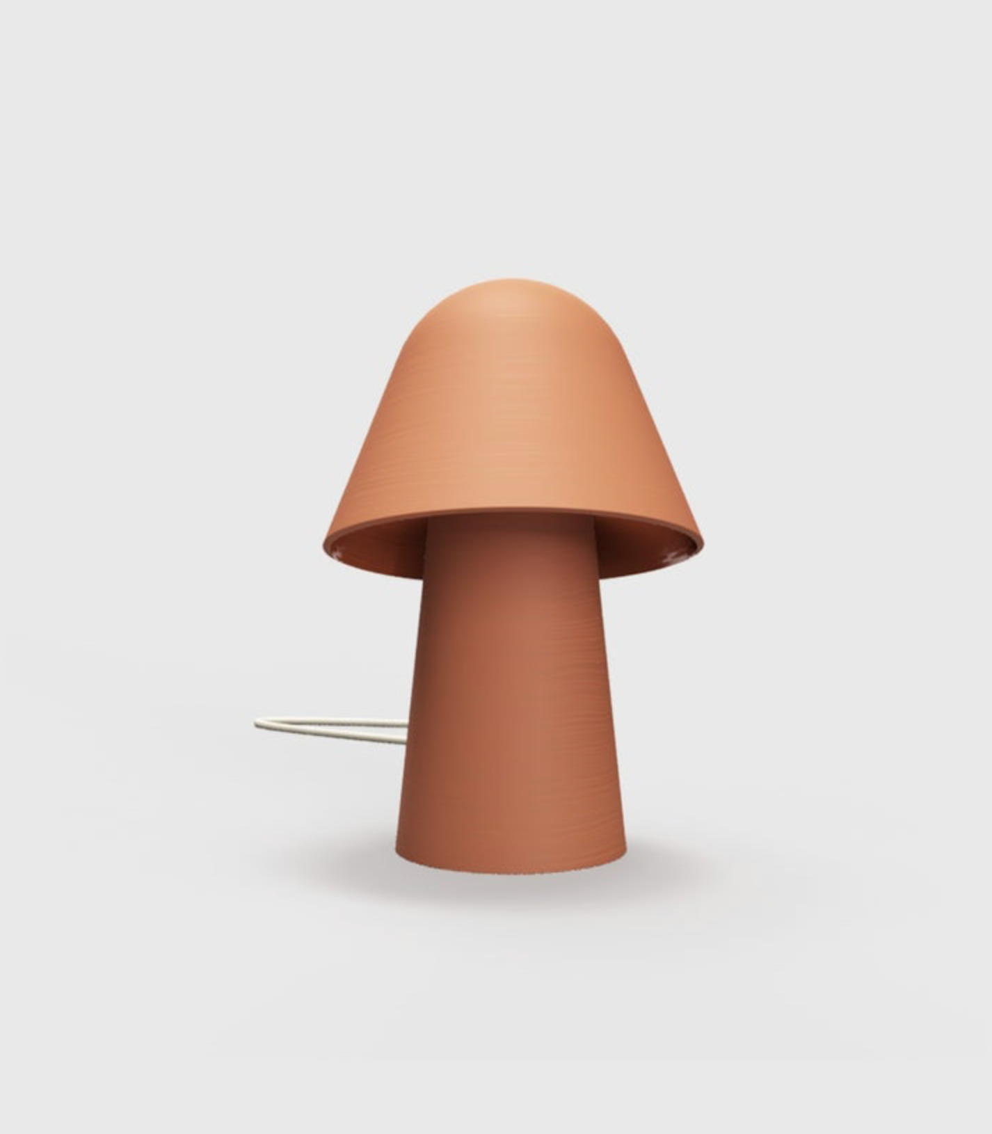 Terracotta mushroom-shaped lamp on a light background
