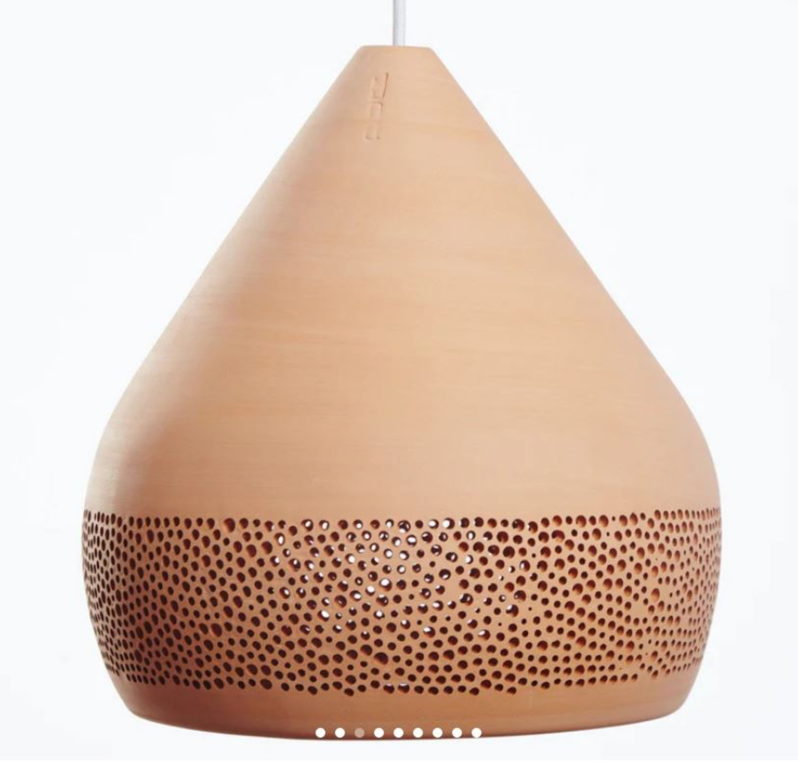 Terracotta clay pendant light with textured design on a white background