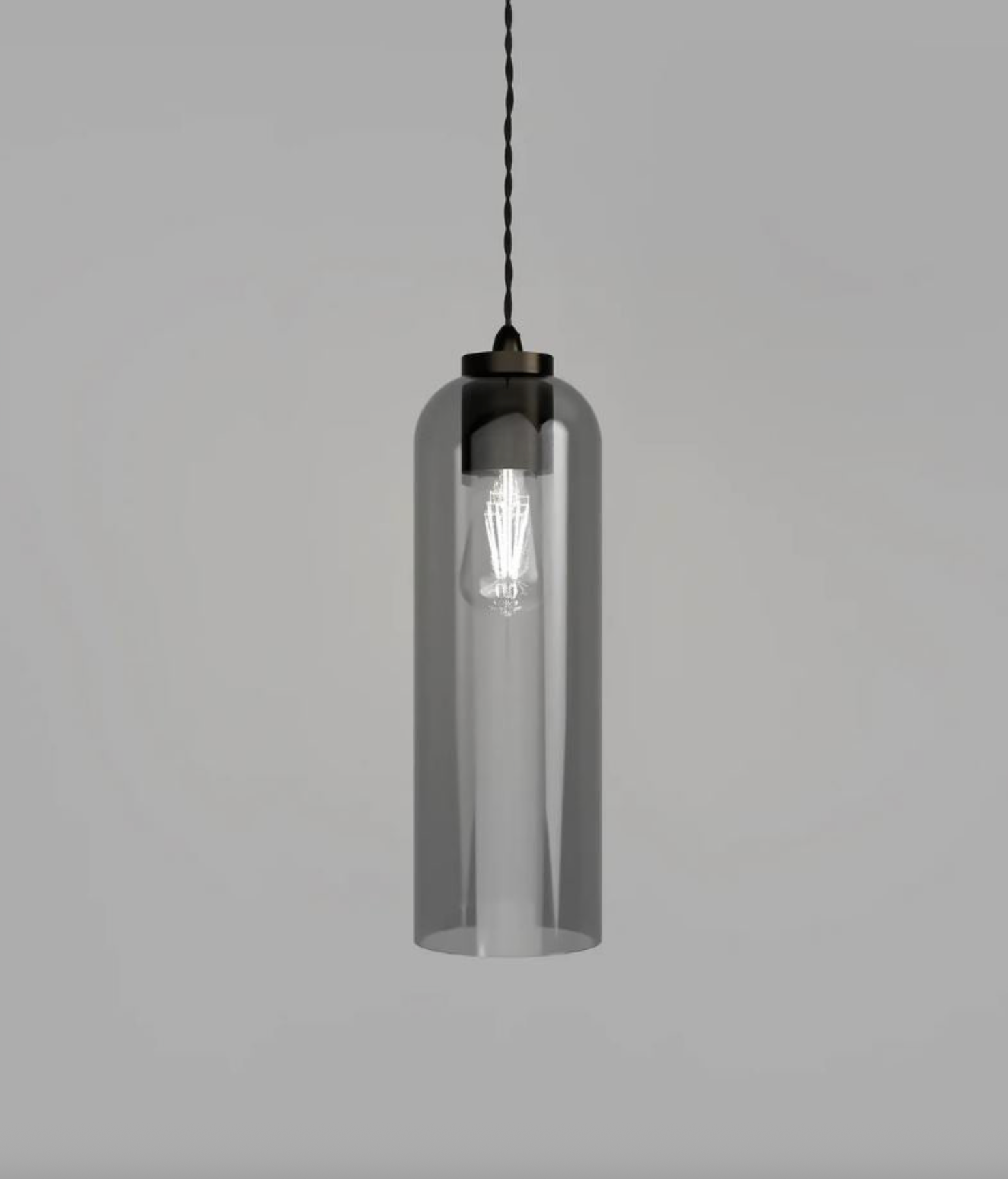 Clear cylindrical pendant light with black fixture on a grey background