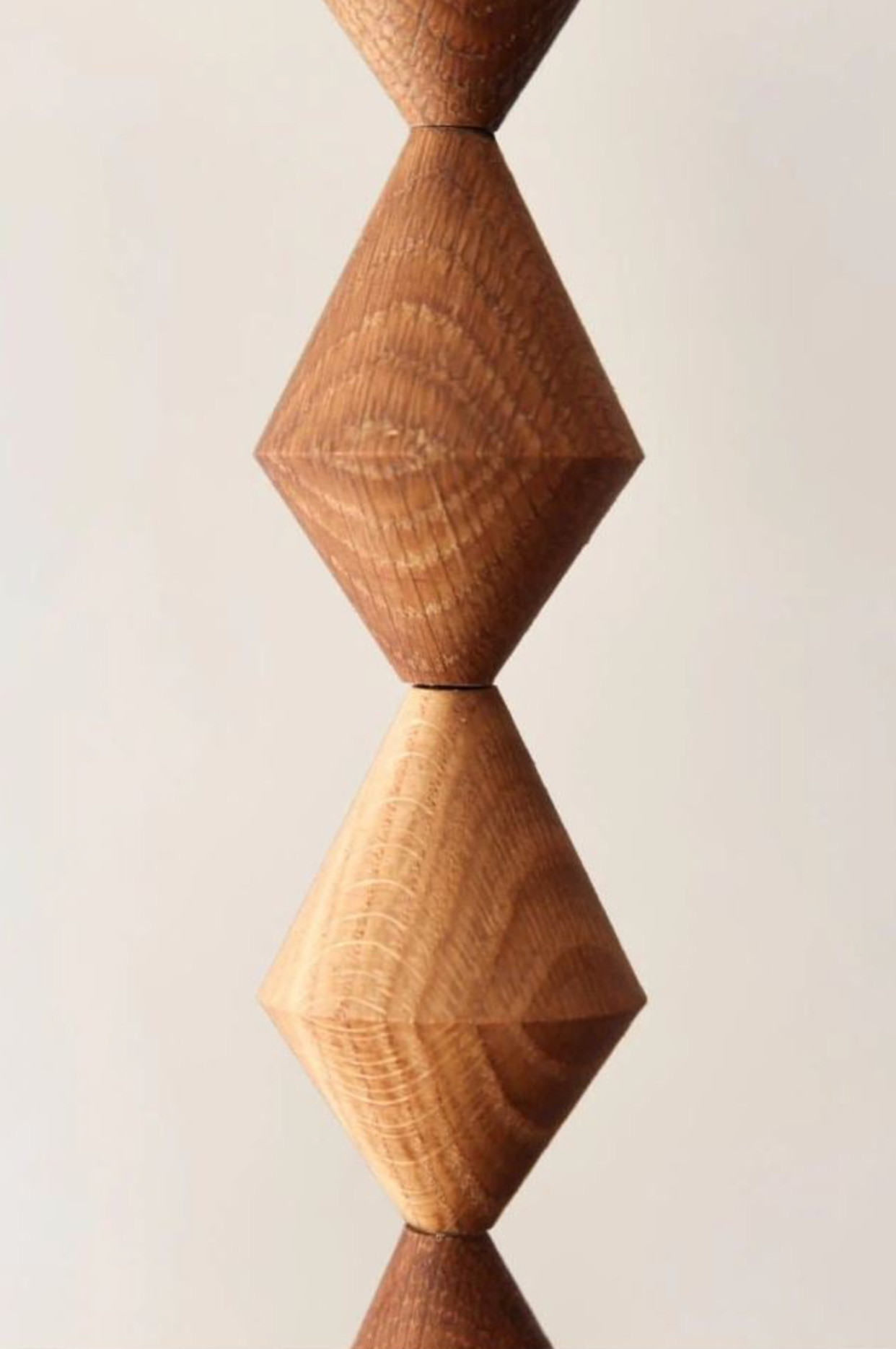 Wooden geometric bead on a white background