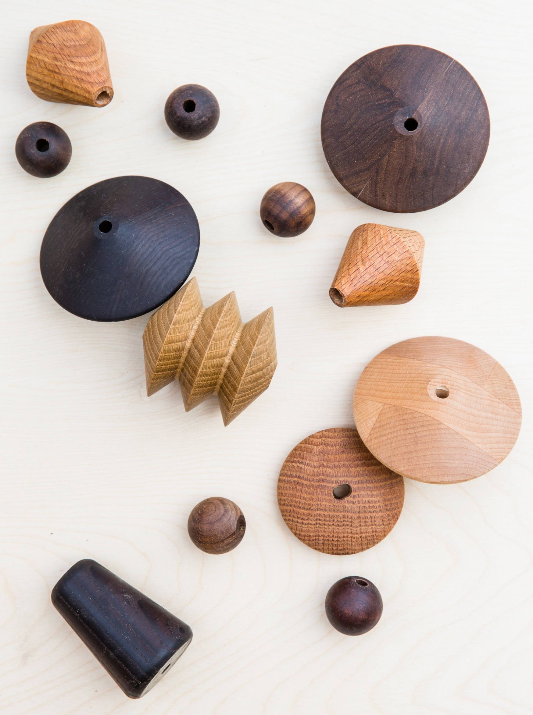Collection of wooden toys on a white background