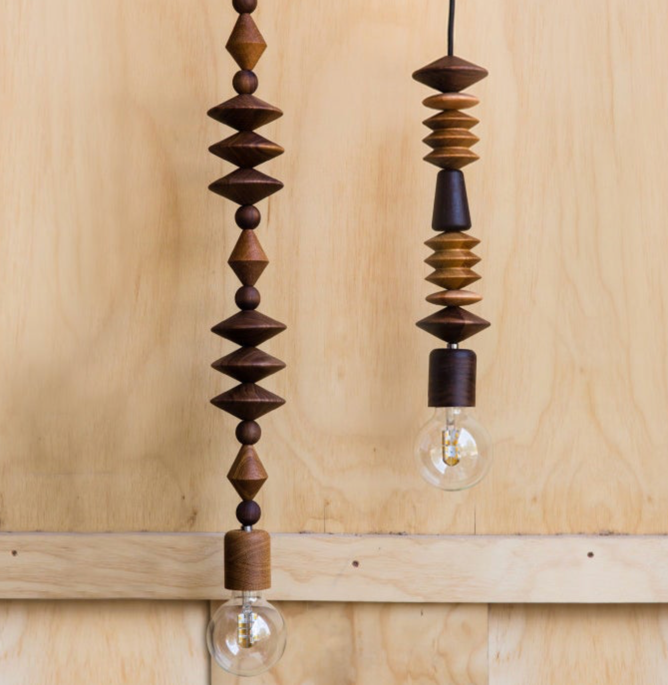 Wooden pendant light with geometric design on a wooden background