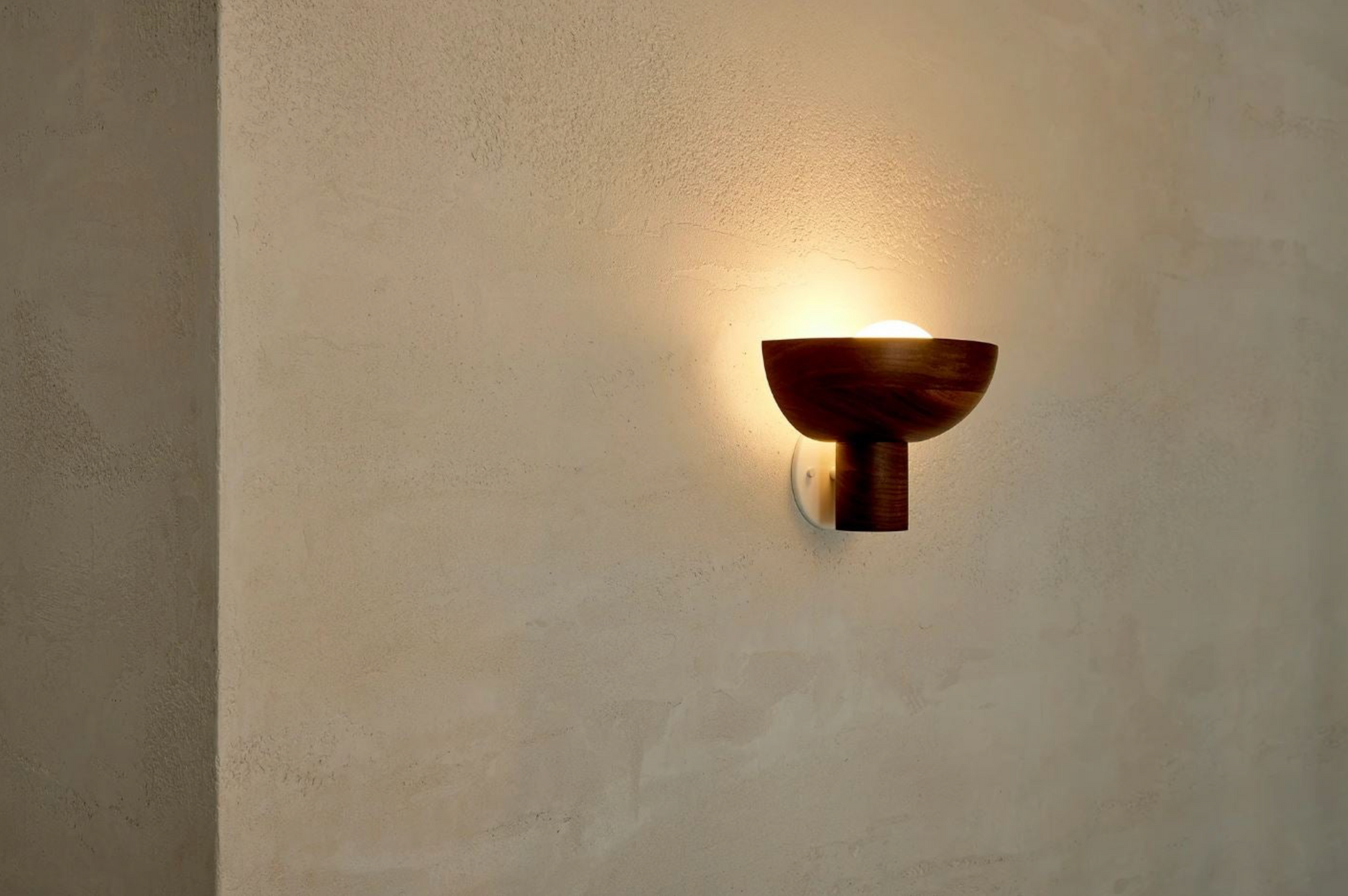 Wall-mounted light fixture on a textured wall