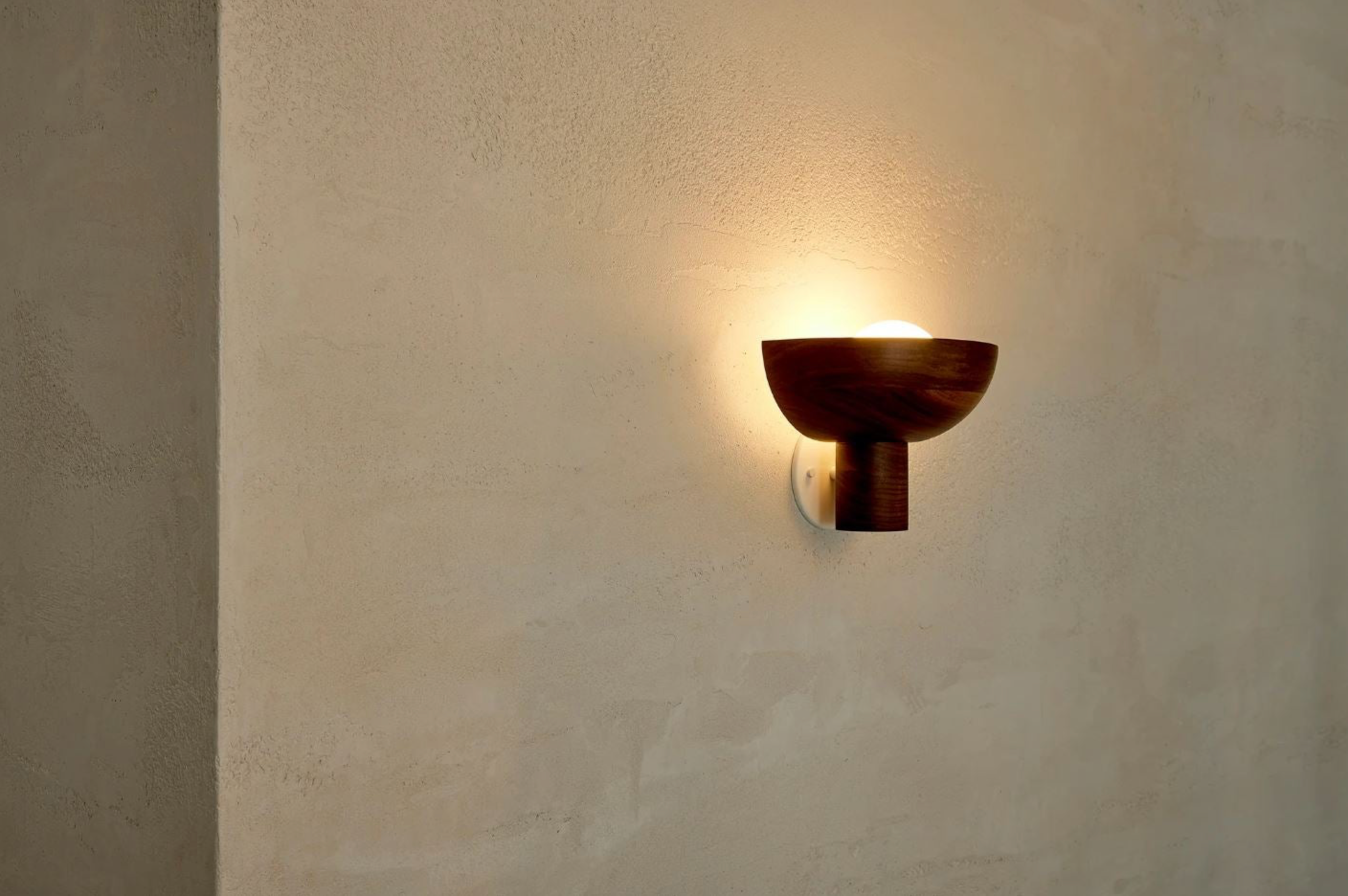 Wall-mounted light fixture on a textured wall