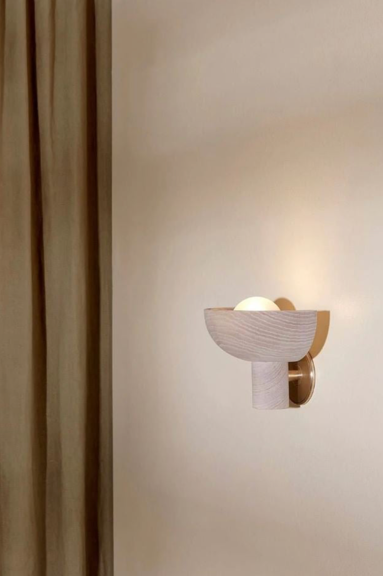 Modern wall light fixture on a neutral wall