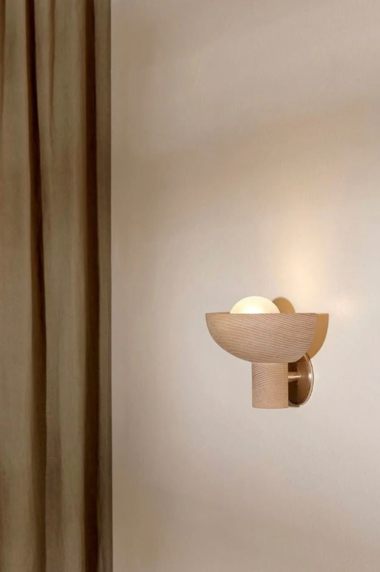 Wooden wall sconce on a neutral wall