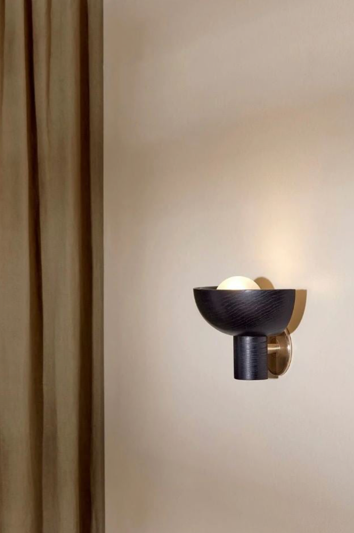 Modern wall sconce on a neutral wall