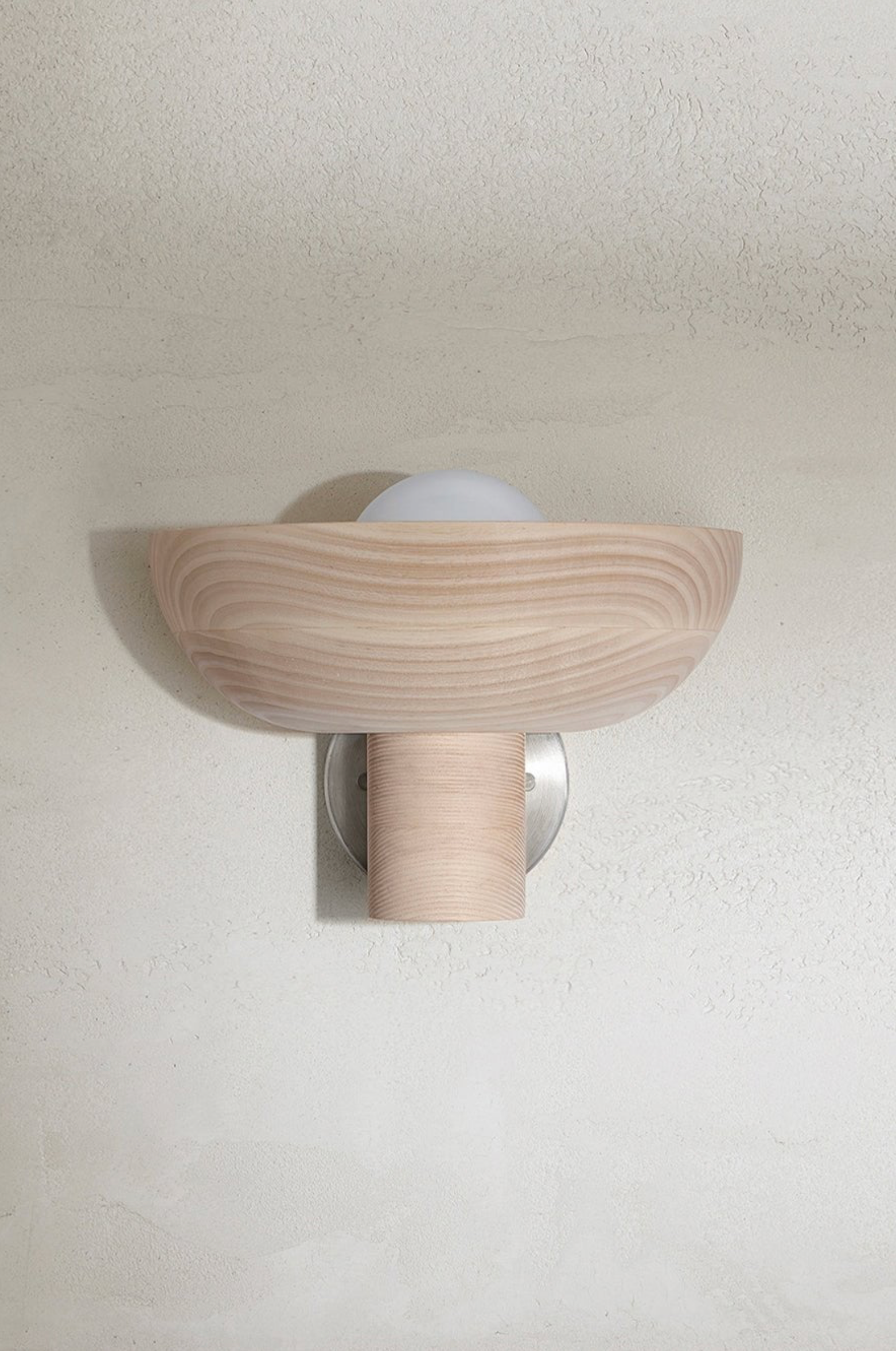 Wooden wall sconce on a plain wall